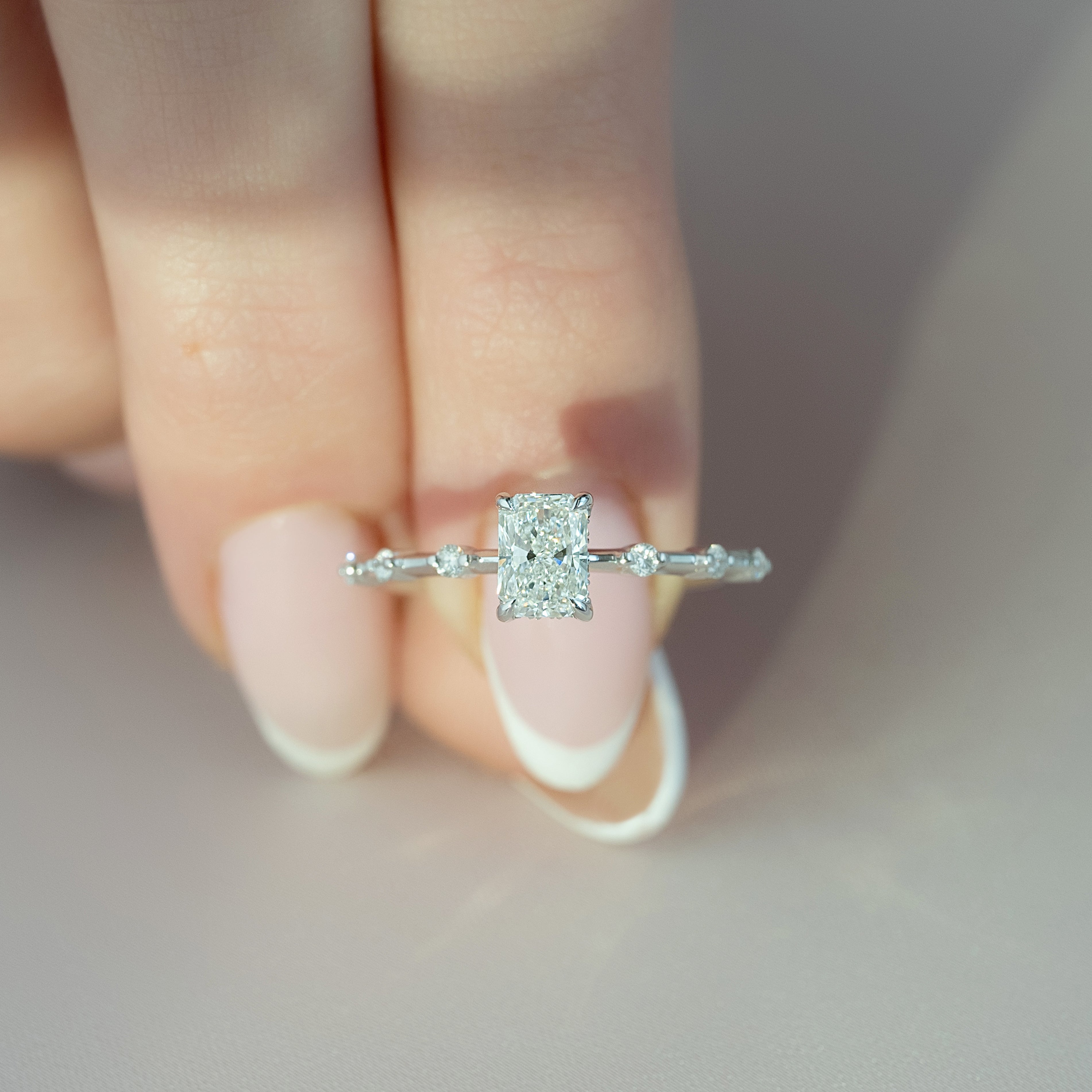 Radiant cut CVD diamond engagement ring with hidden halo in dainty platinum setting