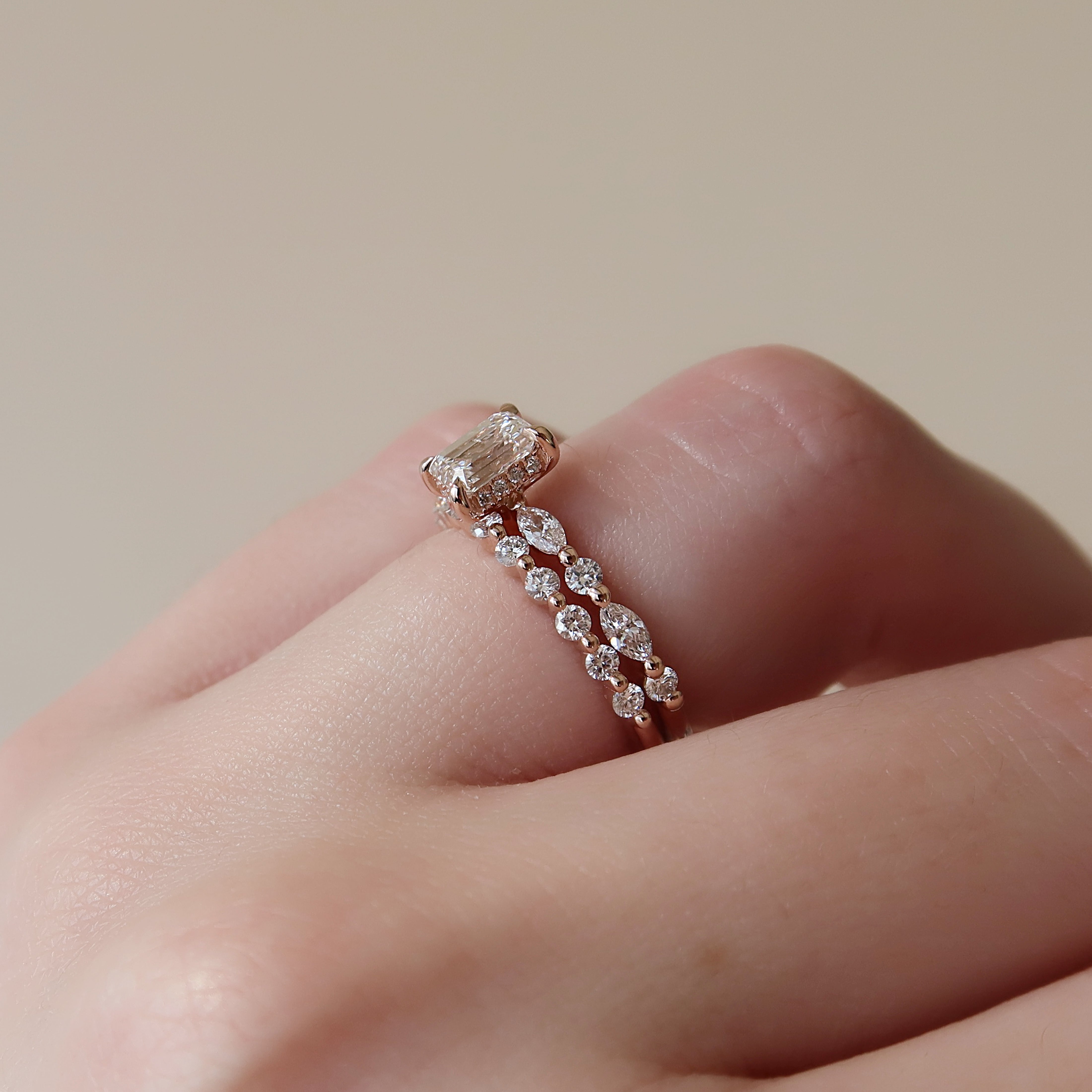 Emerald cut CVD diamond hidden halo engagement ring in white gold setting