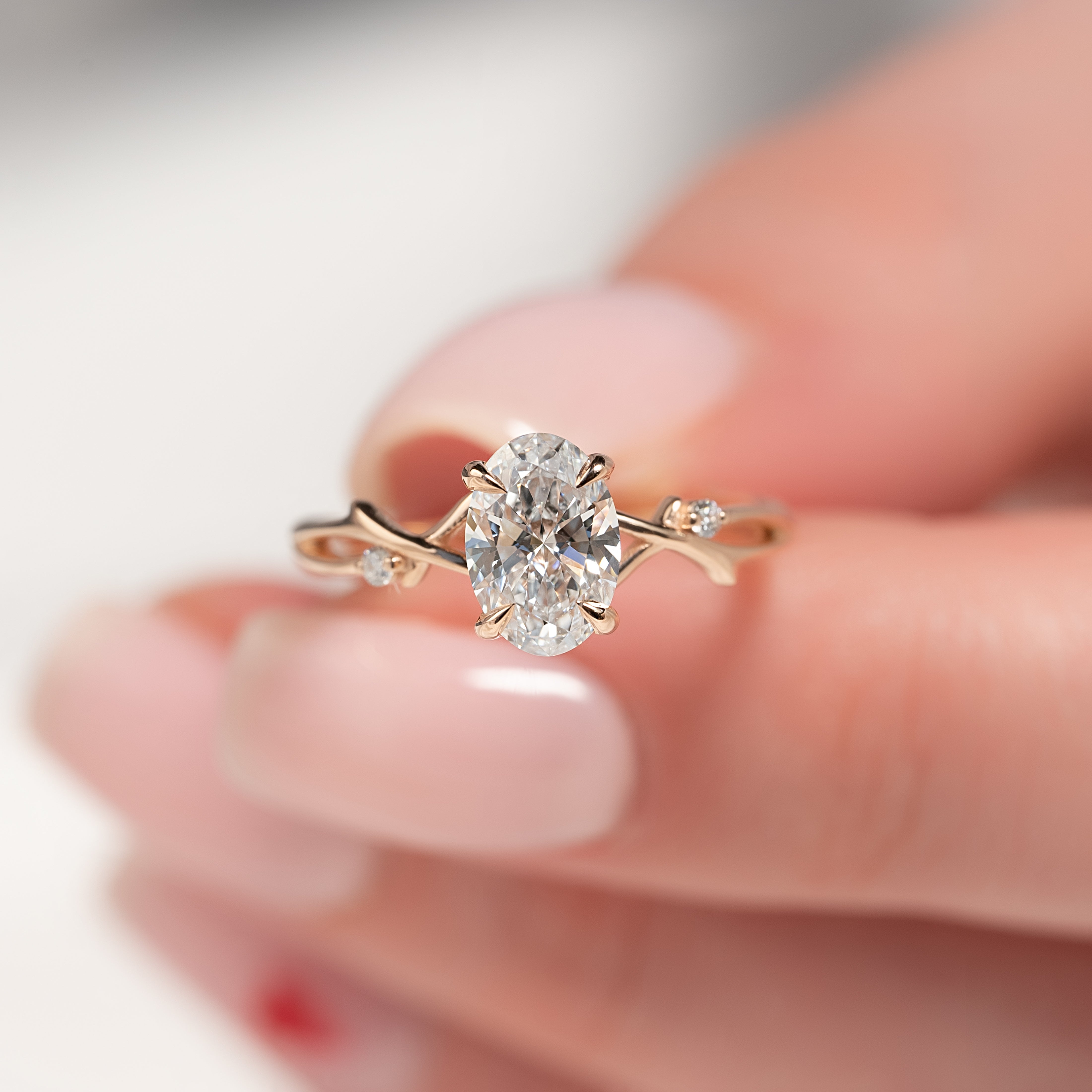 Oval cut CVD diamond engagement ring with twig-style band in white gold