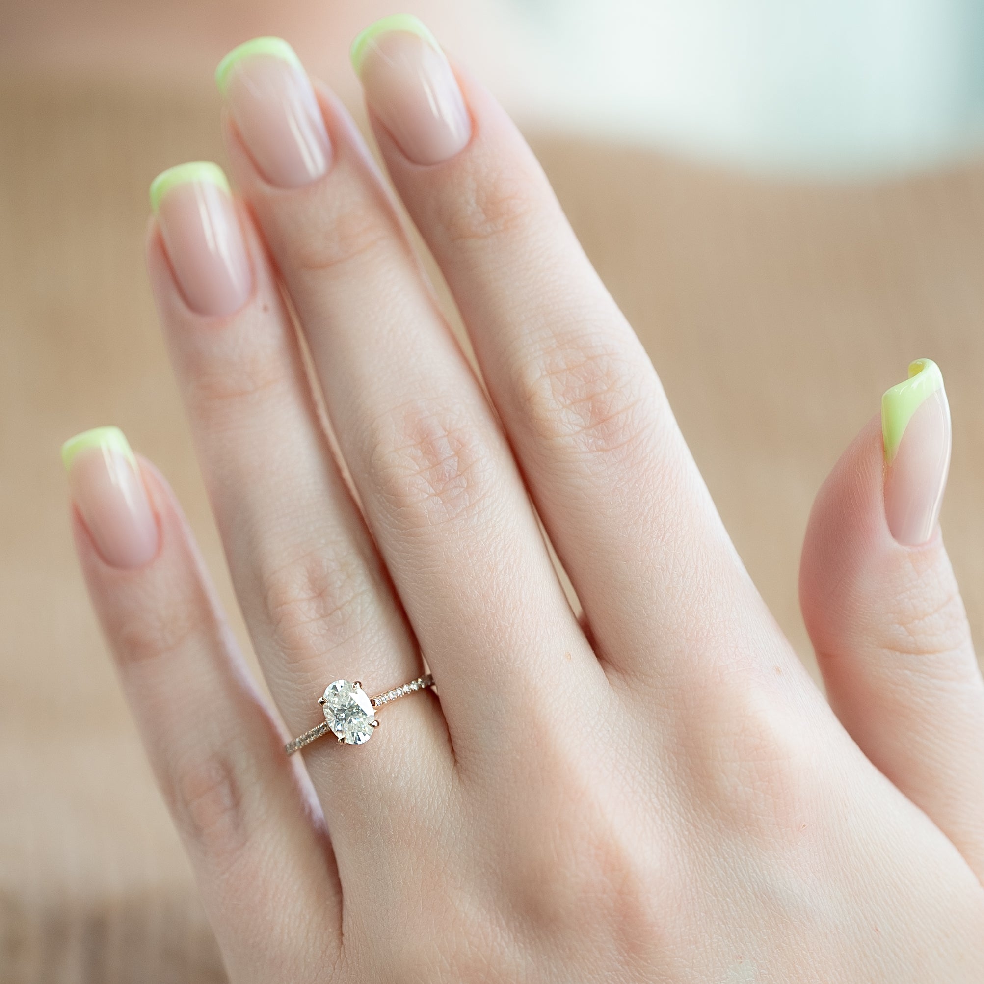 Oval cut CVD diamond engagement ring with pave diamond band in platinum setting