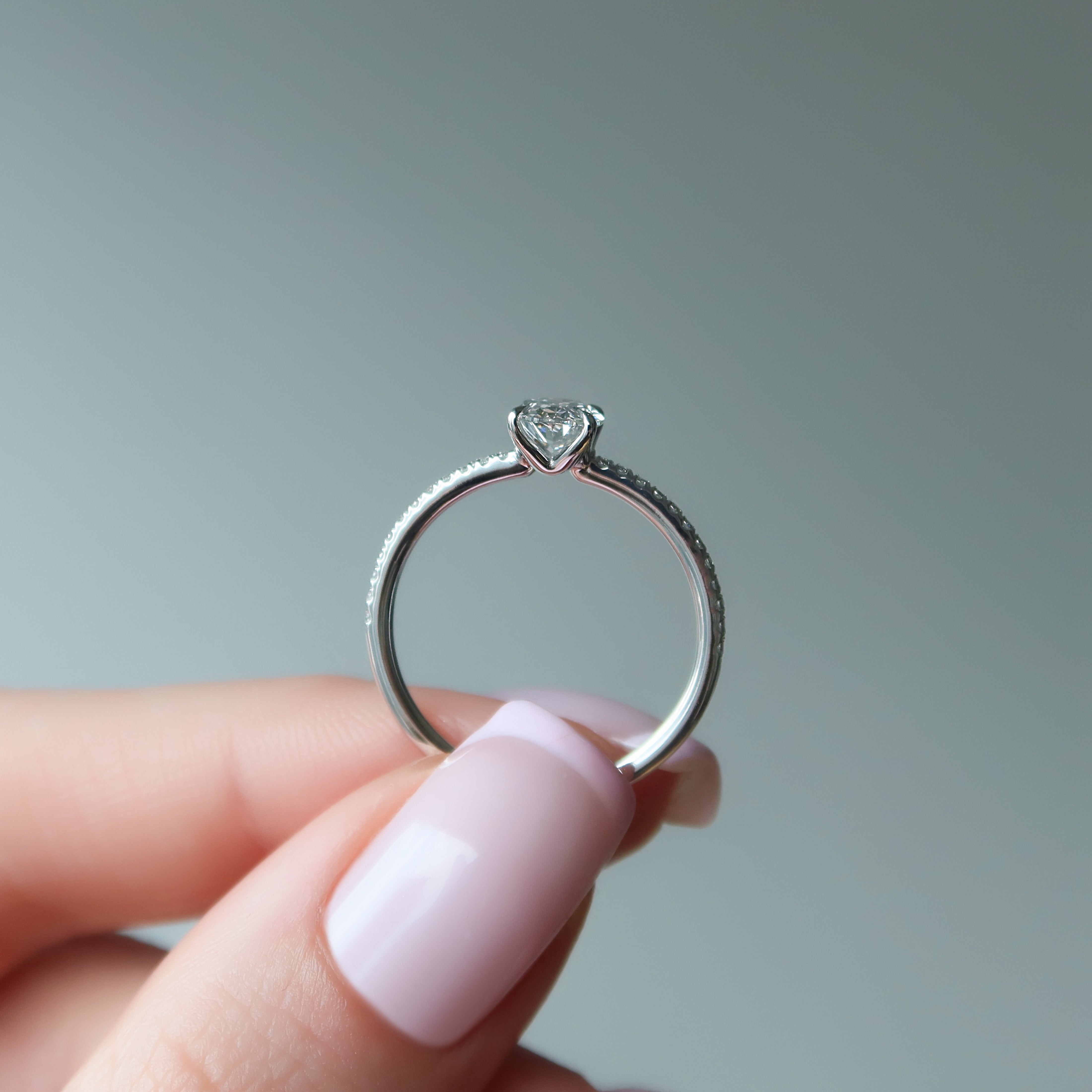 Oval cut CVD diamond pave engagement ring with slim diamond band in white gold