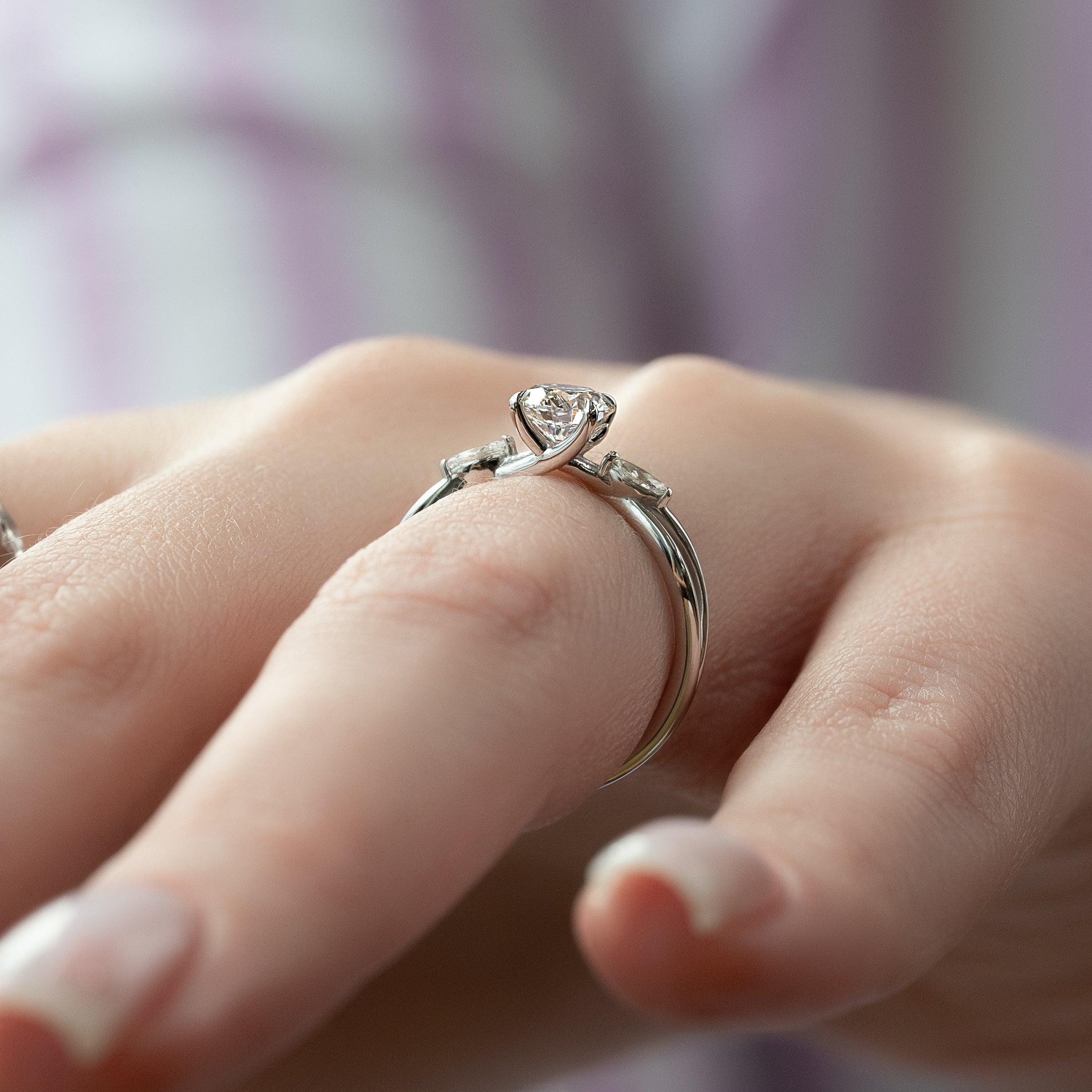 Round cut CVD diamond three stone engagement ring in white gold setting