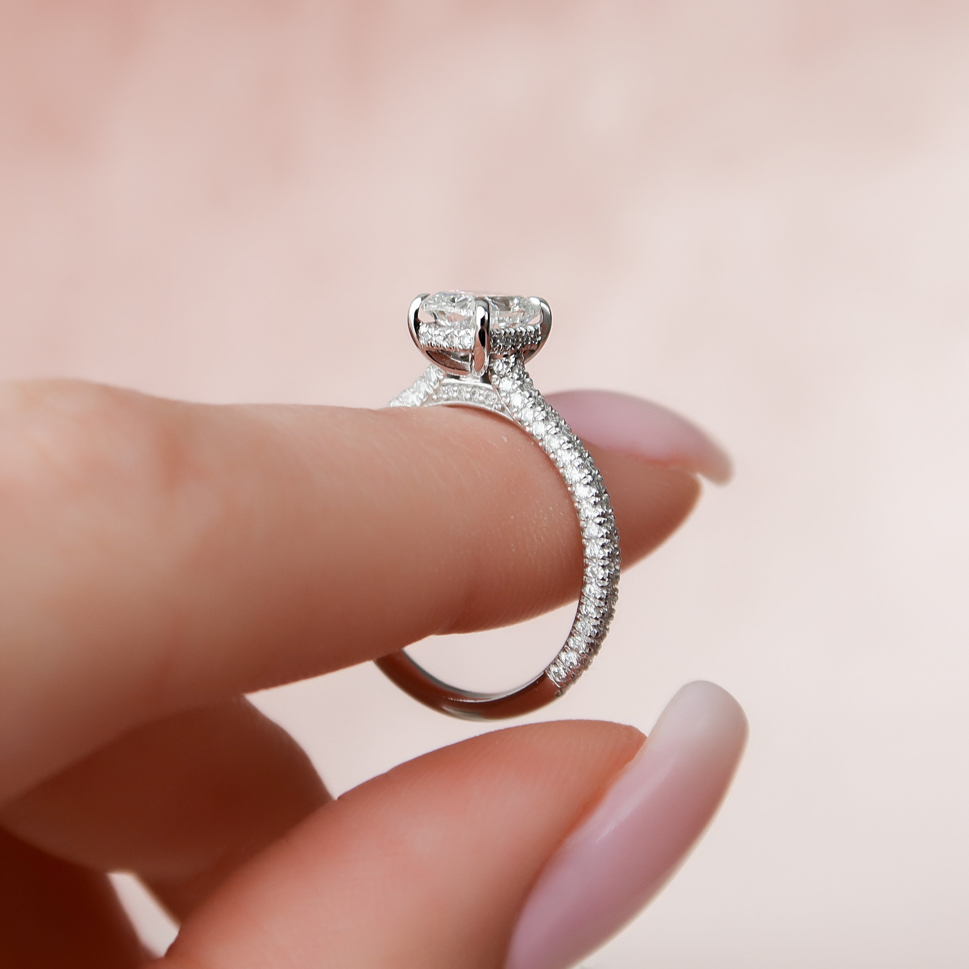 Elongated cushion cut CVD diamond engagement ring with hidden halo and pave diamond band in white gold