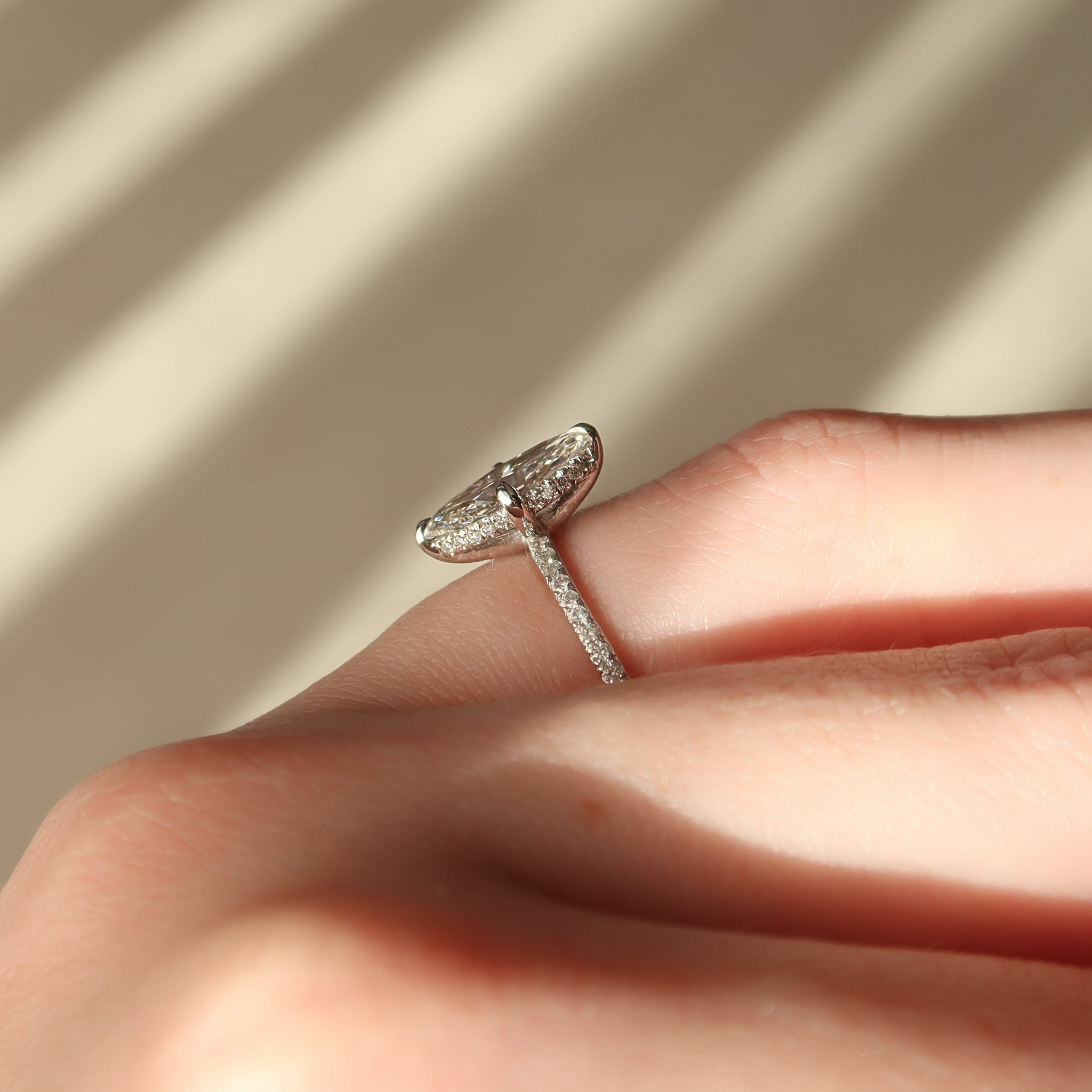 Marquise cut CVD diamond hidden halo engagement ring with pave band in white gold