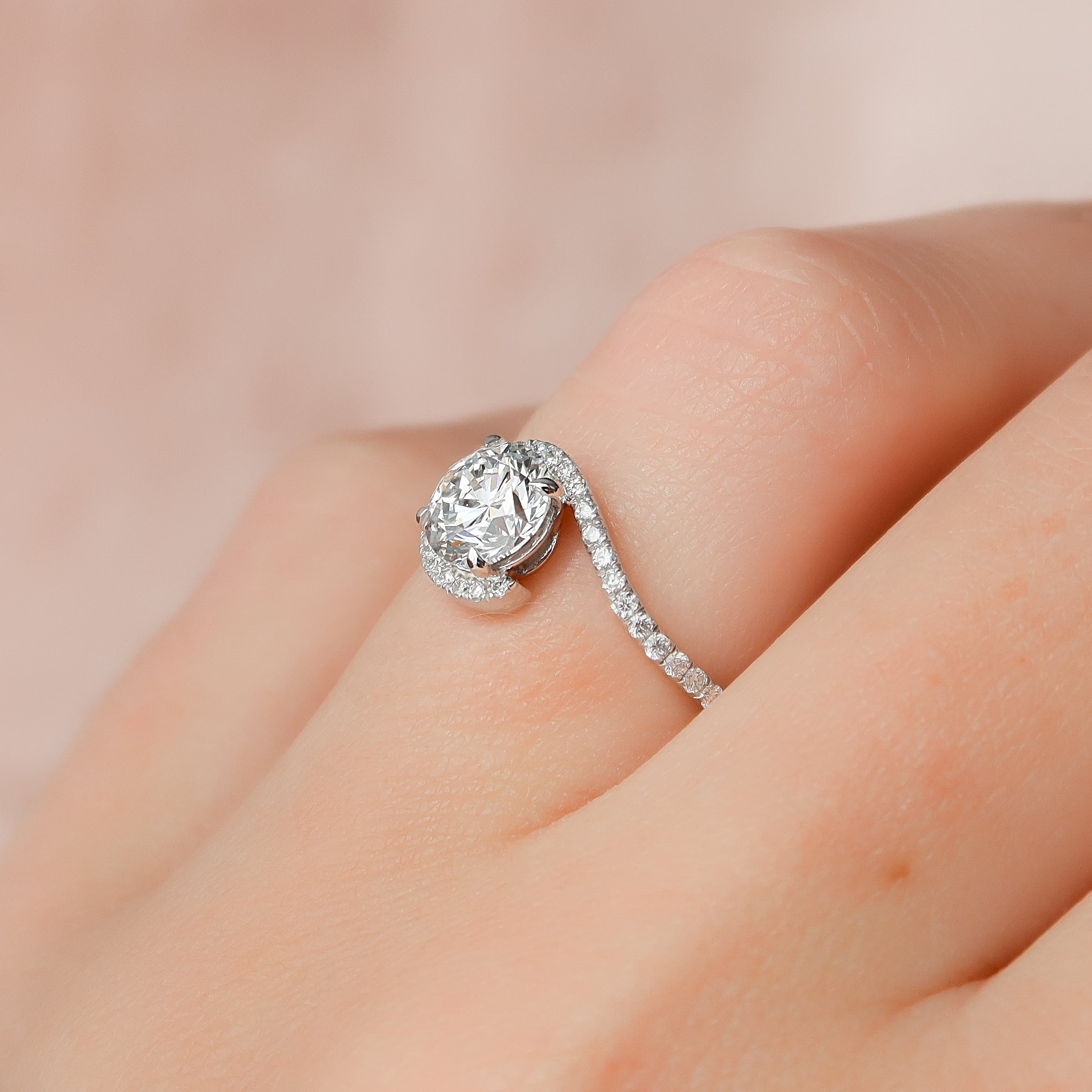 Round cut moissanite engagement ring in bypass setting with white gold band