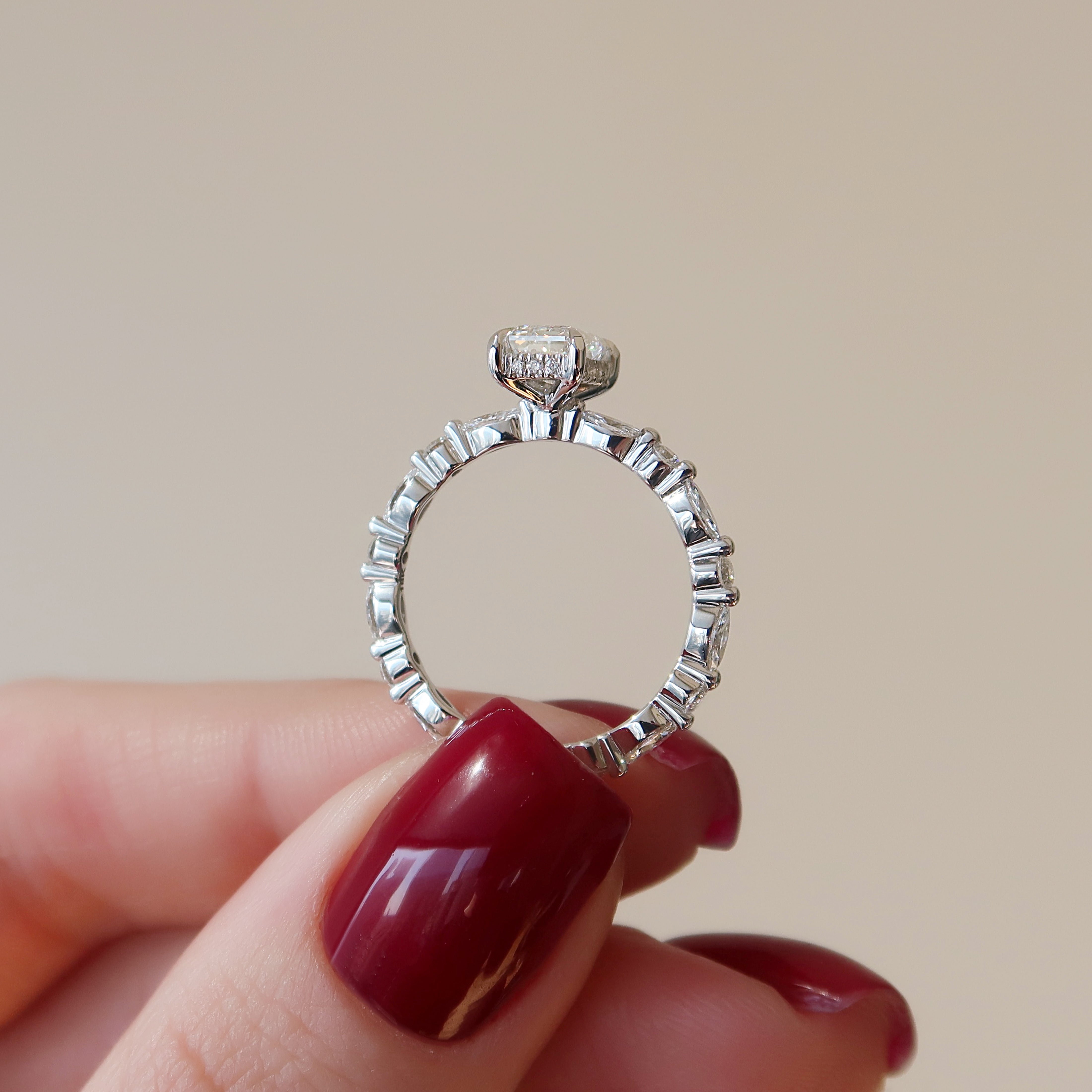 Emerald cut CVD diamond hidden halo engagement ring in white gold setting