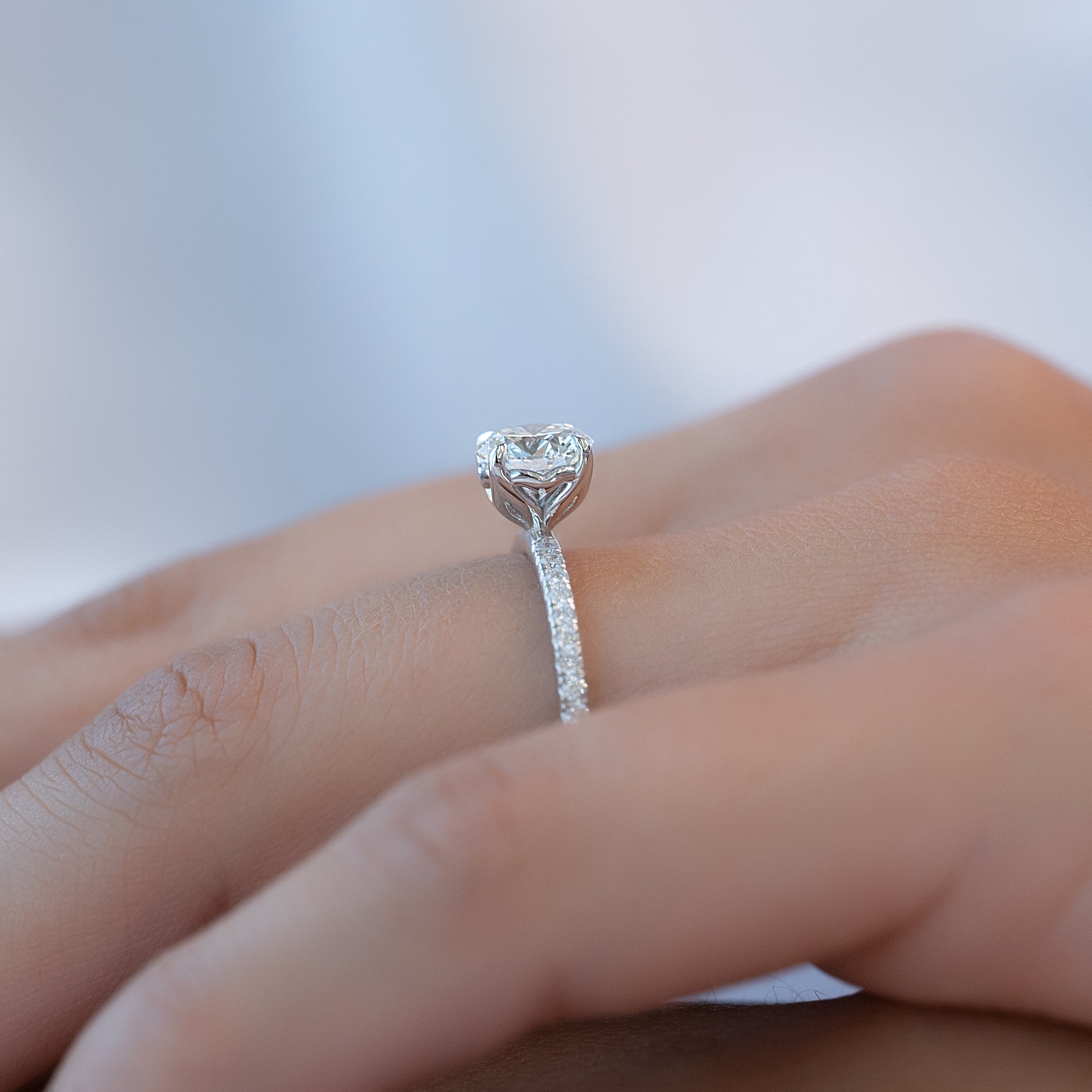 Round cut CVD diamond engagement ring with delicate pave diamond band in platinum