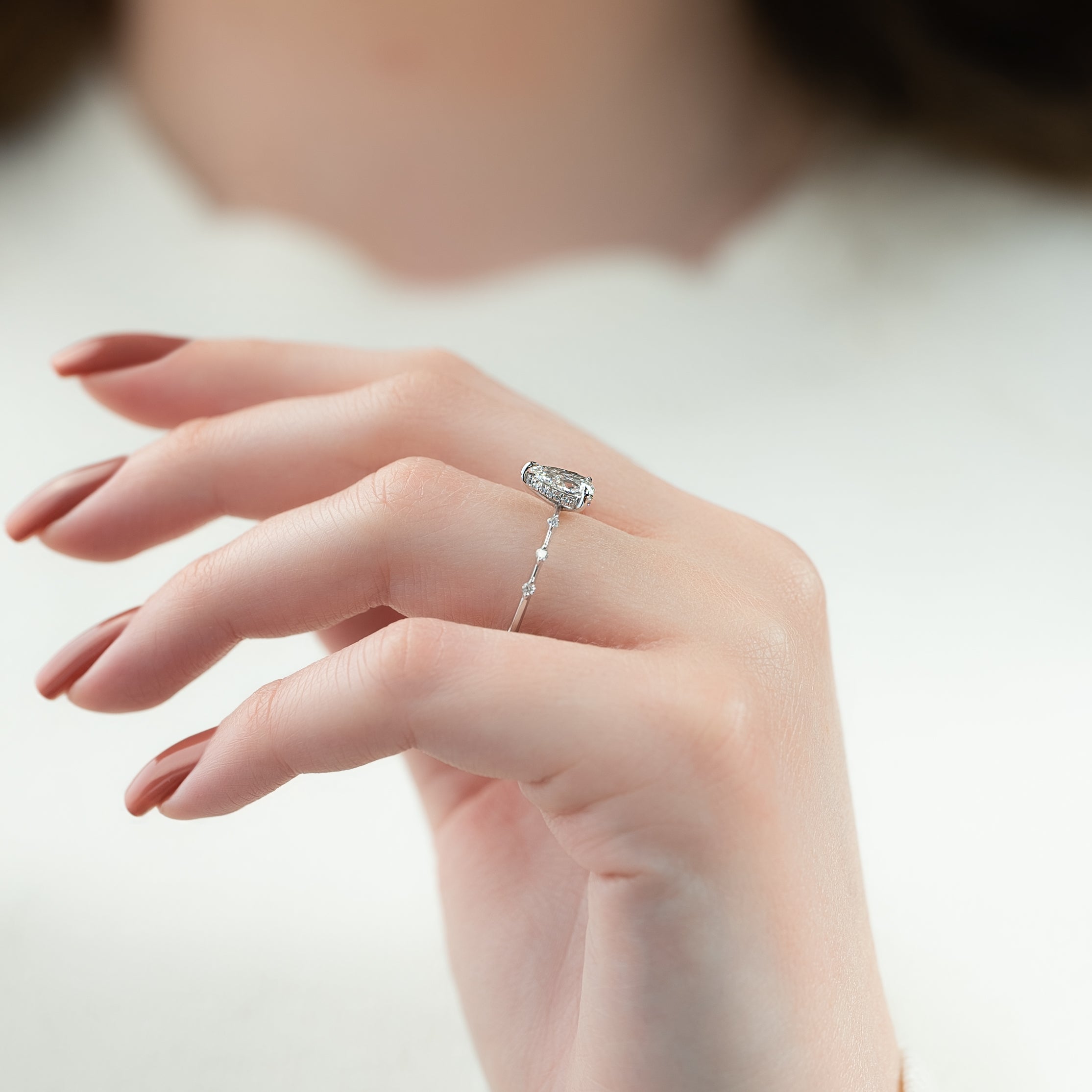 Pear cut CVD diamond engagement ring with hidden halo and dainty pave band in white gold