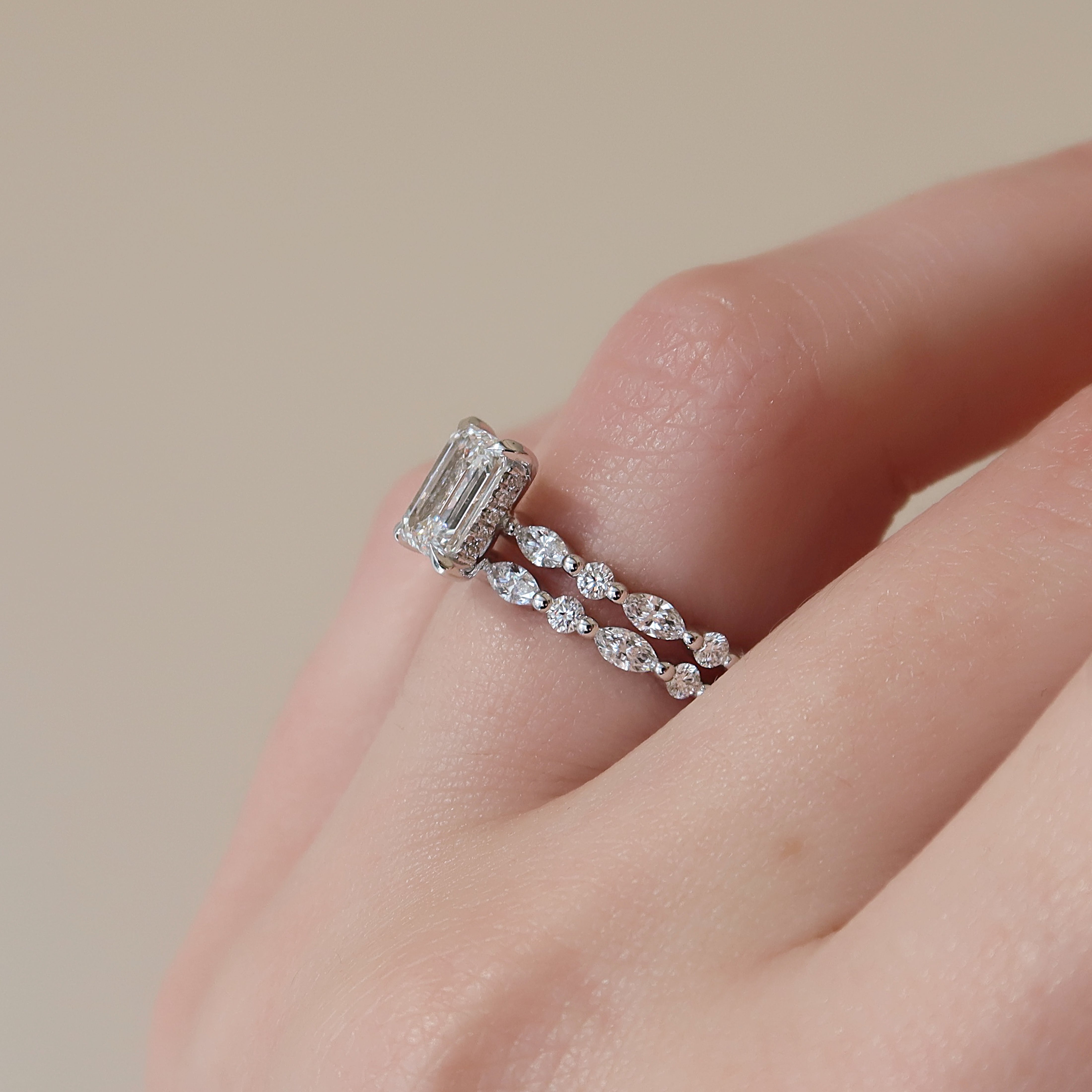 Emerald cut CVD diamond hidden halo engagement ring in white gold setting