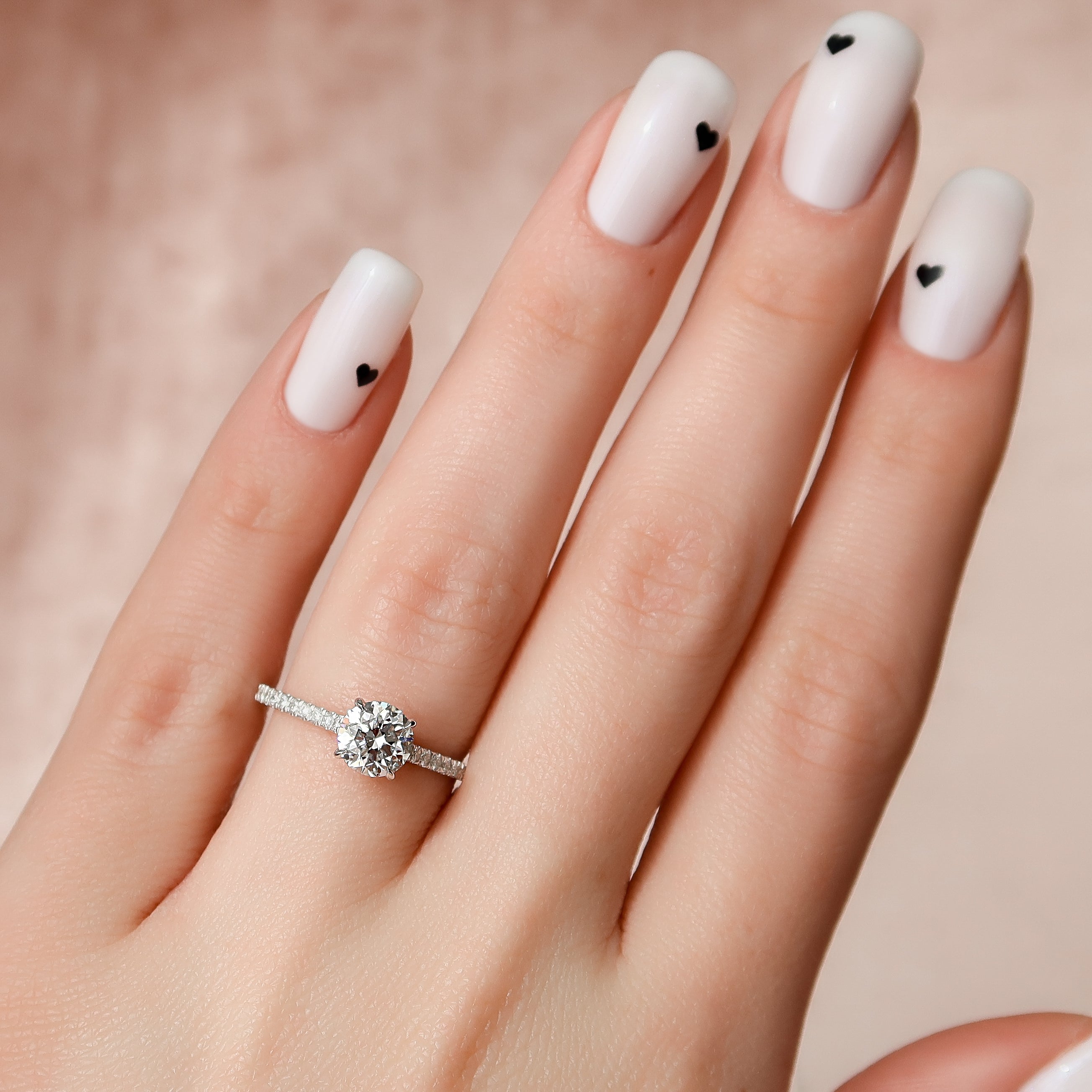 Round cut CVD diamond hidden halo engagement ring with pave diamond band in platinum setting