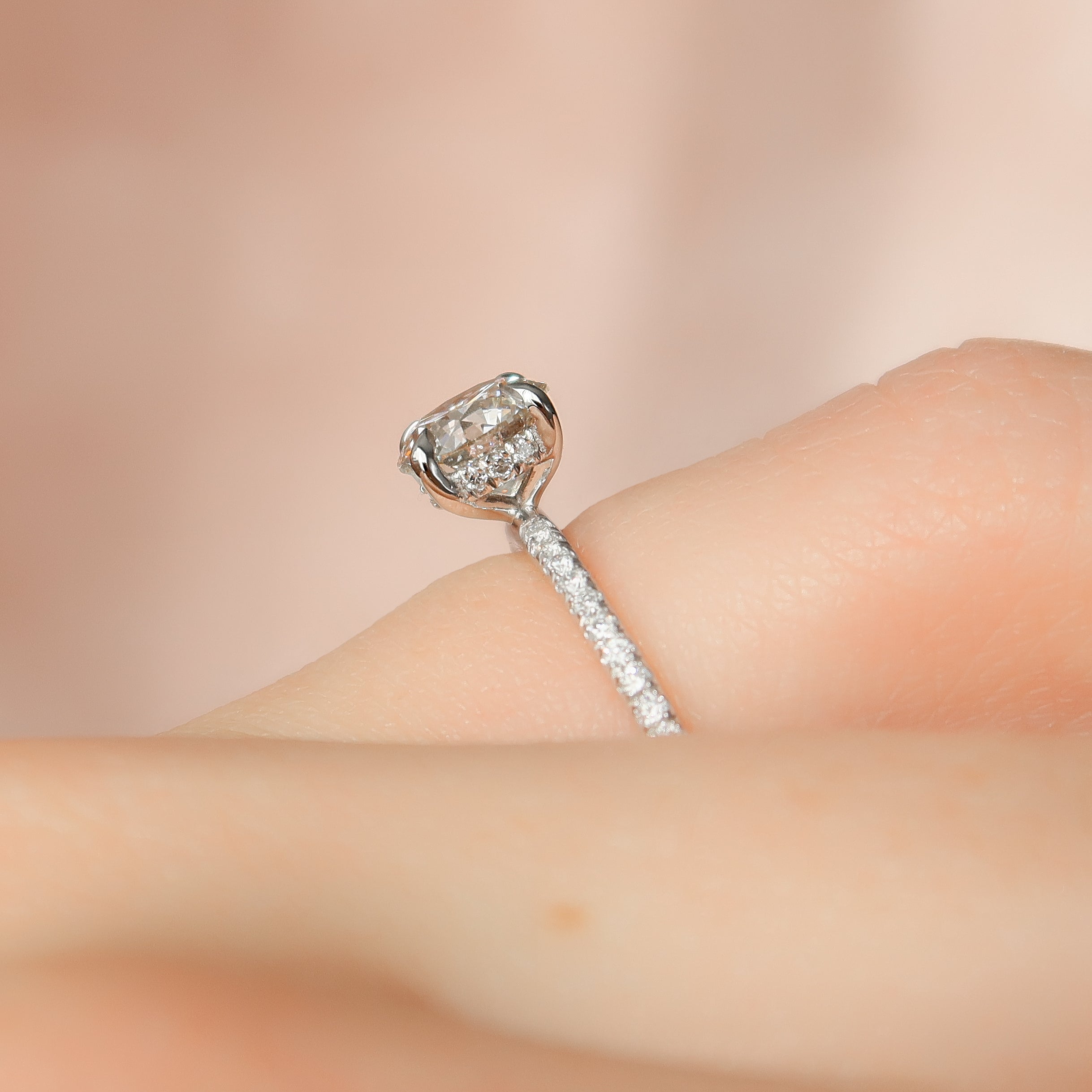 Round cut CVD diamond hidden halo engagement ring with pave band in white gold setting