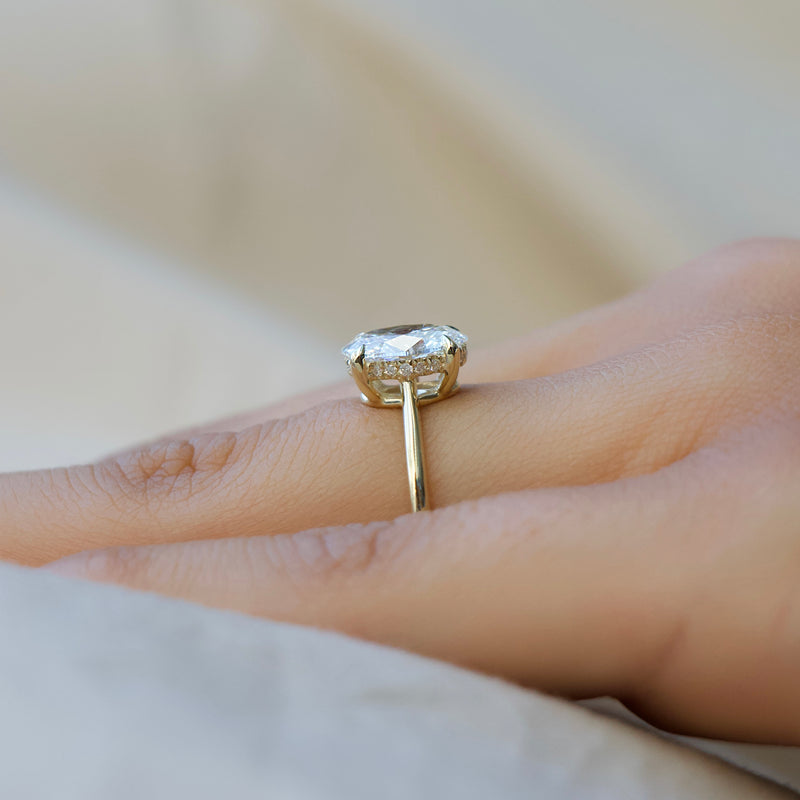 Oval cut CVD diamond engagement ring with hidden halo in white gold setting