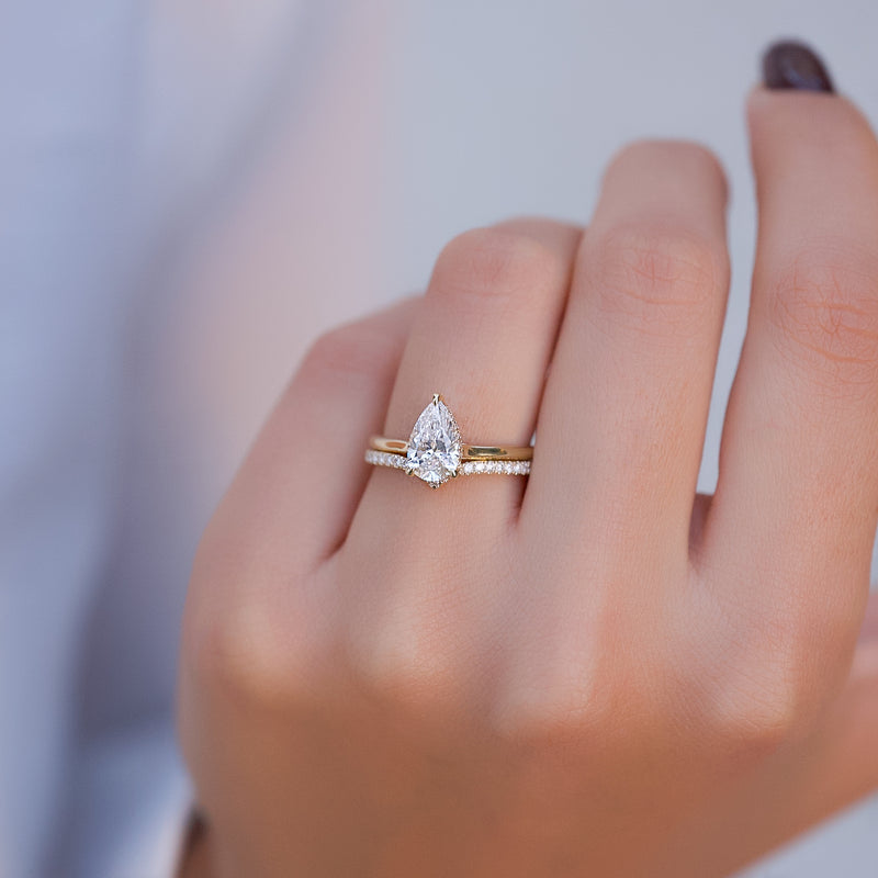 Pear cut CVD diamond engagement ring with hidden halo in white gold setting