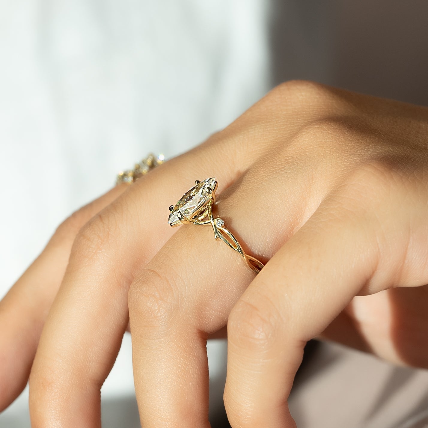 Marquise cut CVD diamond engagement ring with twig-style band in white gold