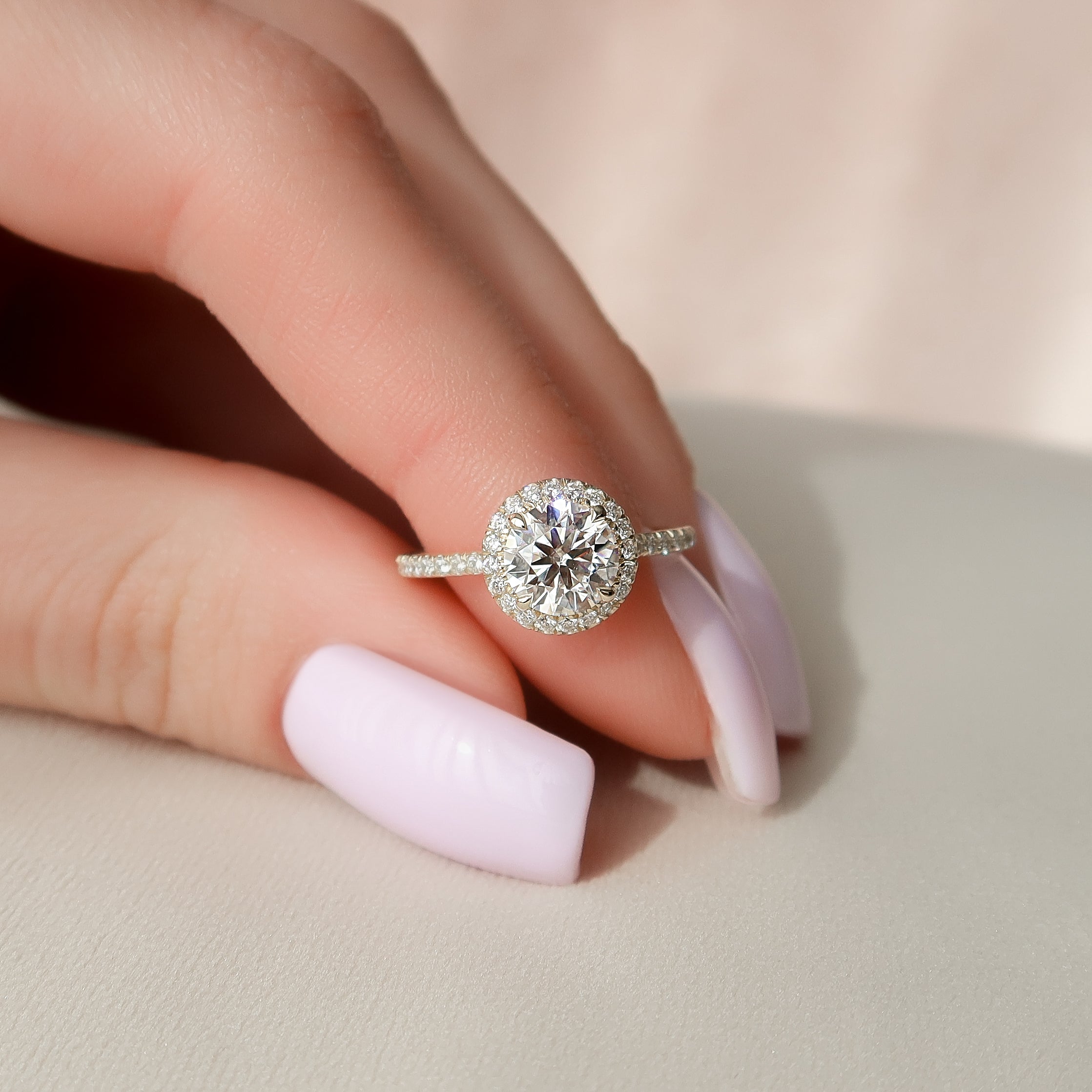 Round cut CVD diamond engagement ring with halo and pave diamond band in platinum setting