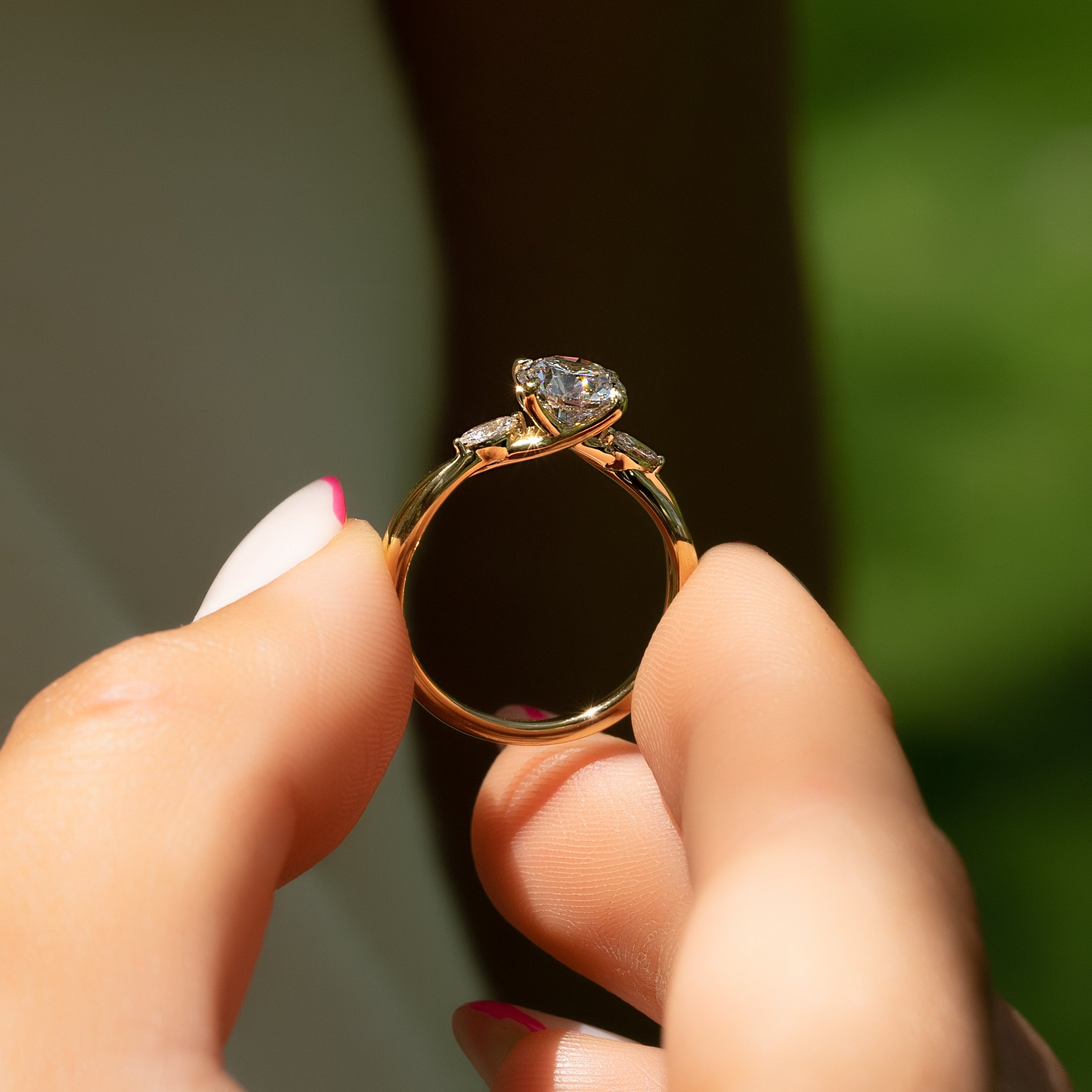 Round cut CVD diamond three stone engagement ring in white gold setting