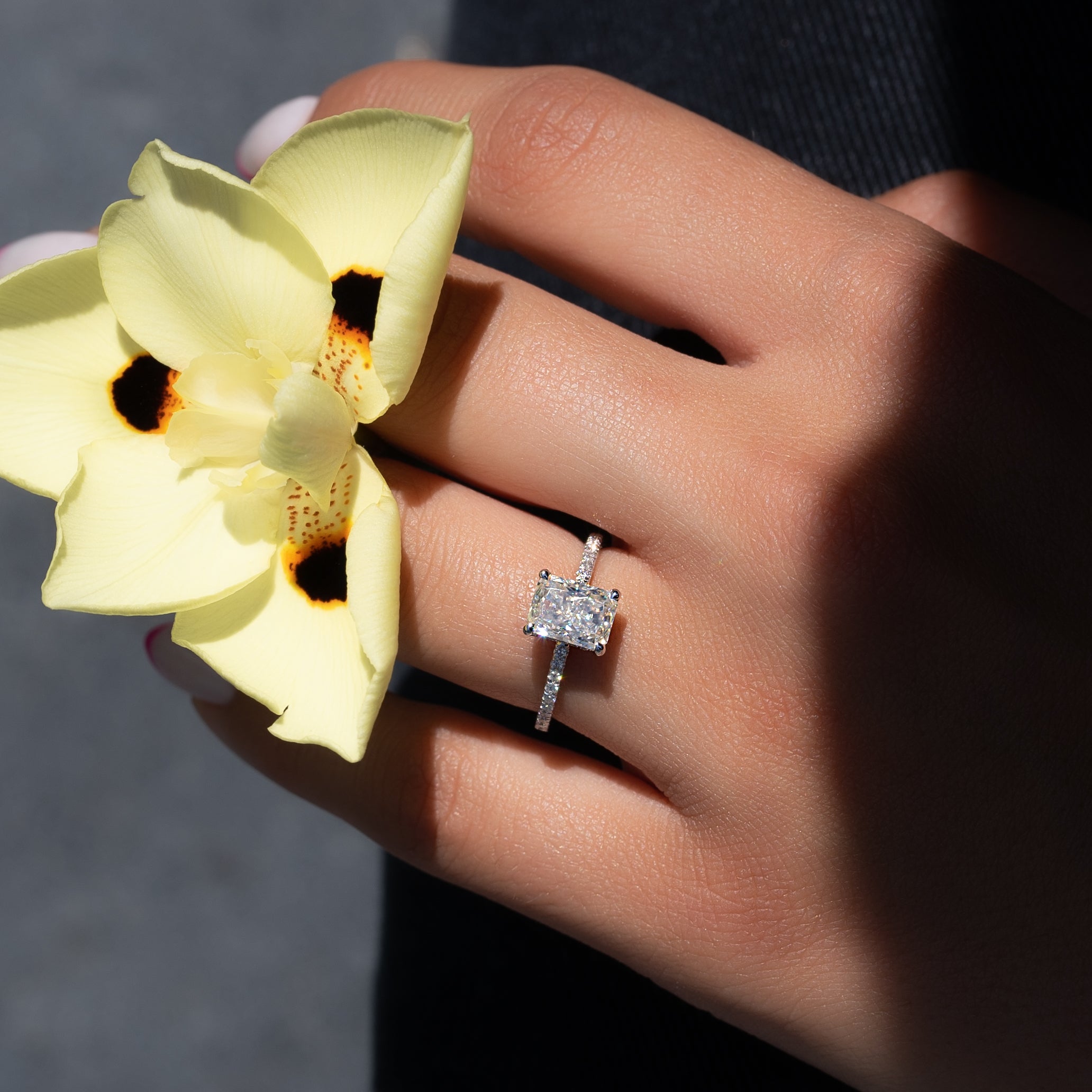 Radiant cut CVD diamond engagement ring with hidden halo and pave diamond band in white gold