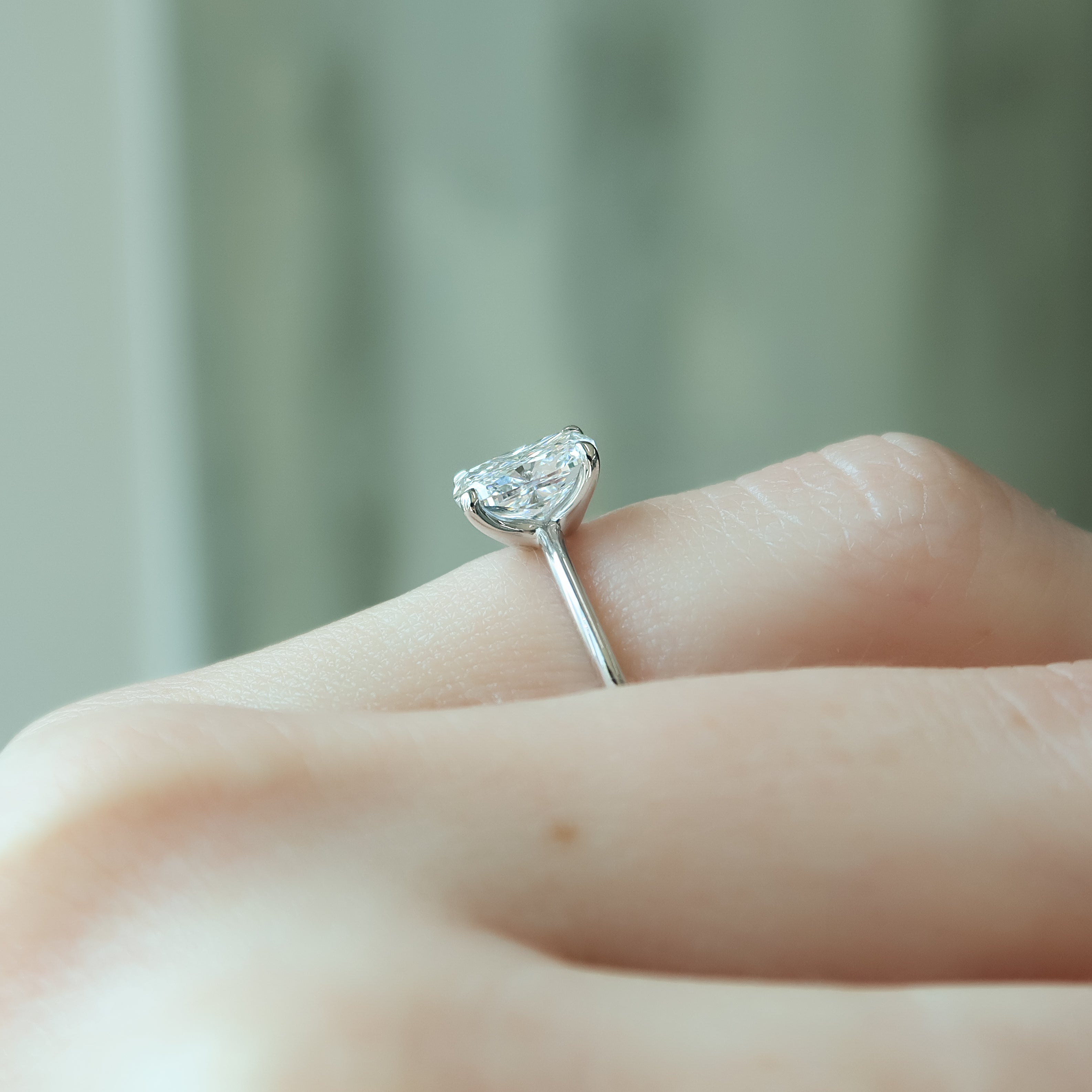 Elongated cushion cut CVD diamond solitaire engagement ring in white gold setting