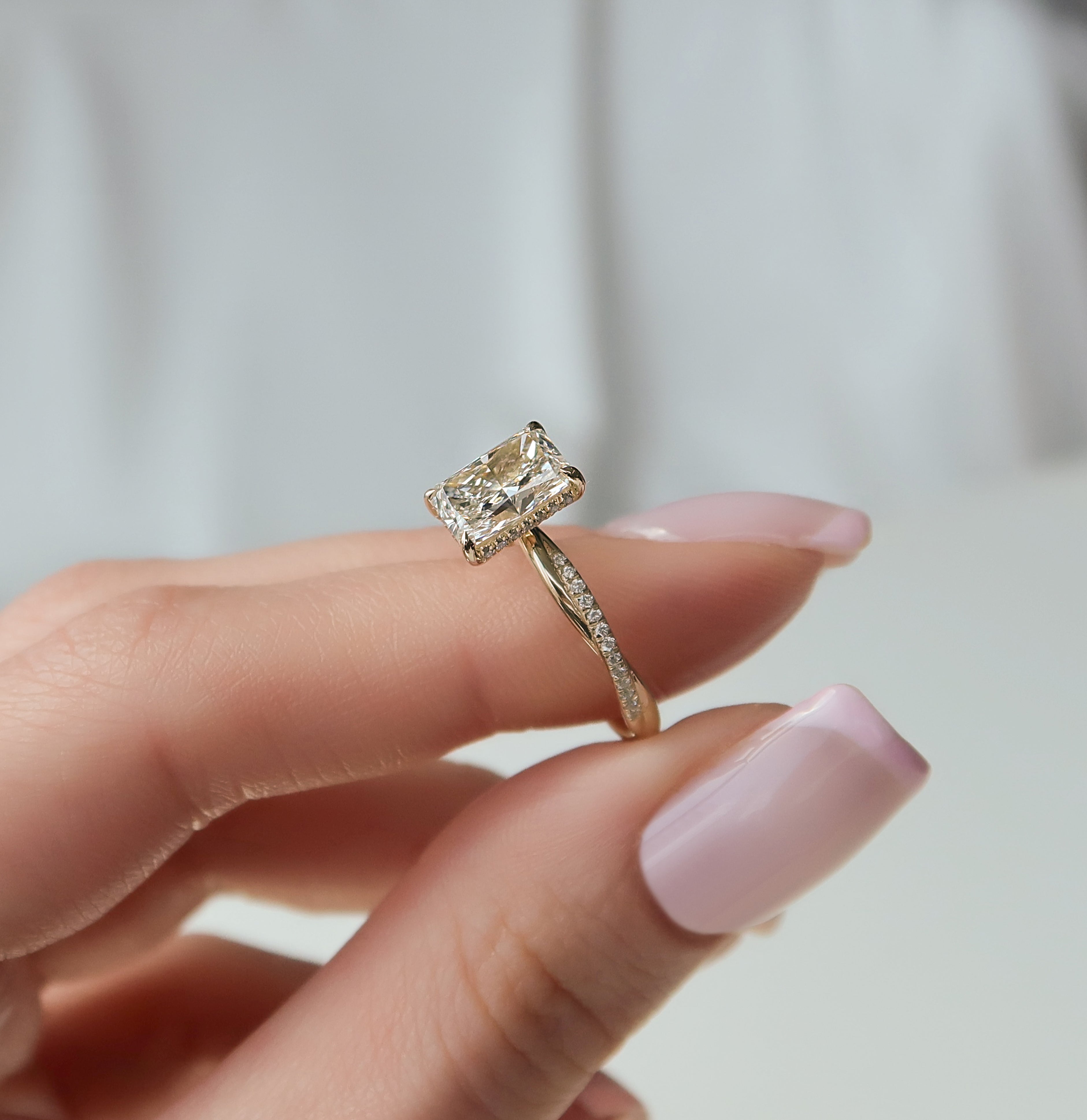 Radiant cut CVD diamond twisted pave engagement ring in white gold setting