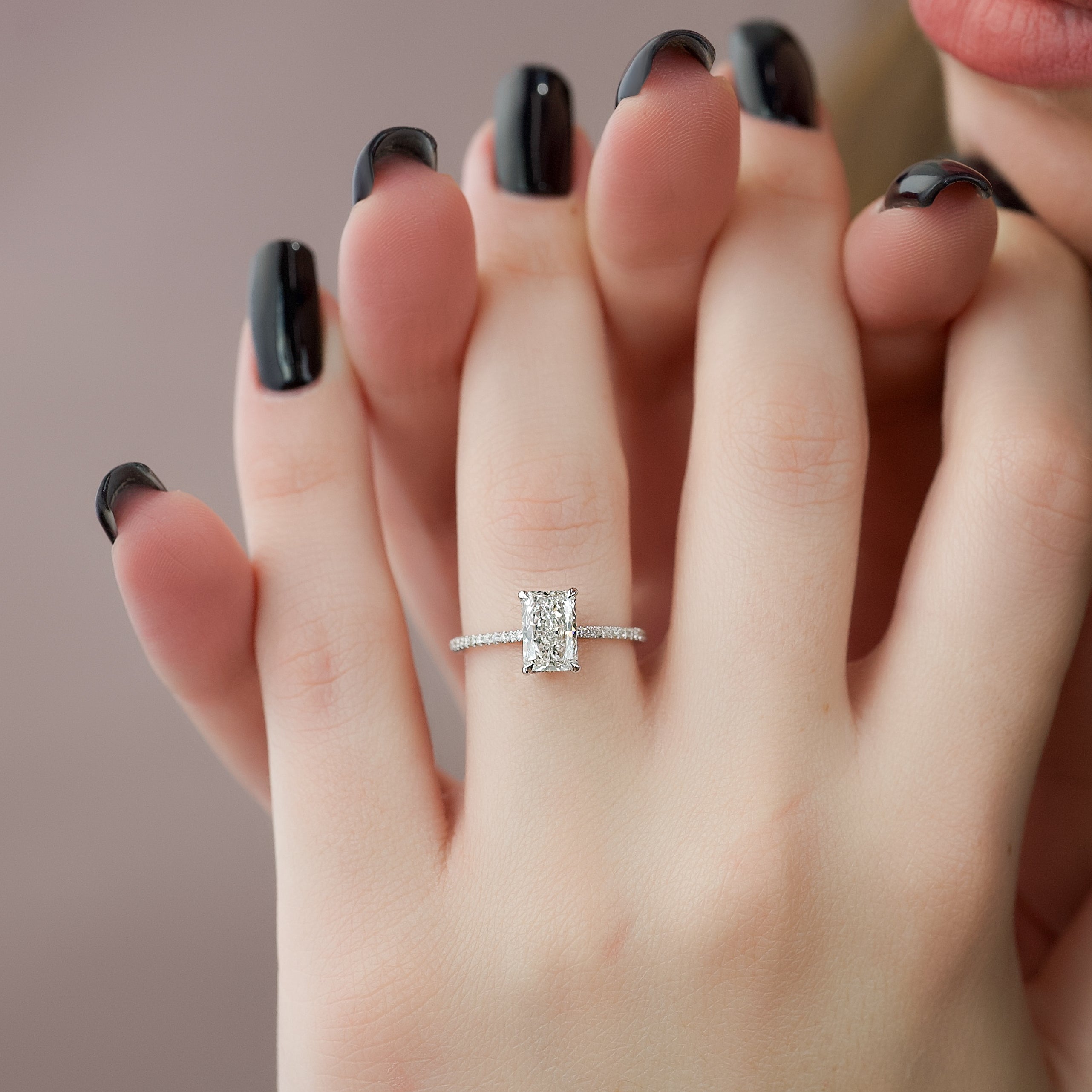 Radiant cut moissanite engagement ring with hidden halo and pave setting in platinum