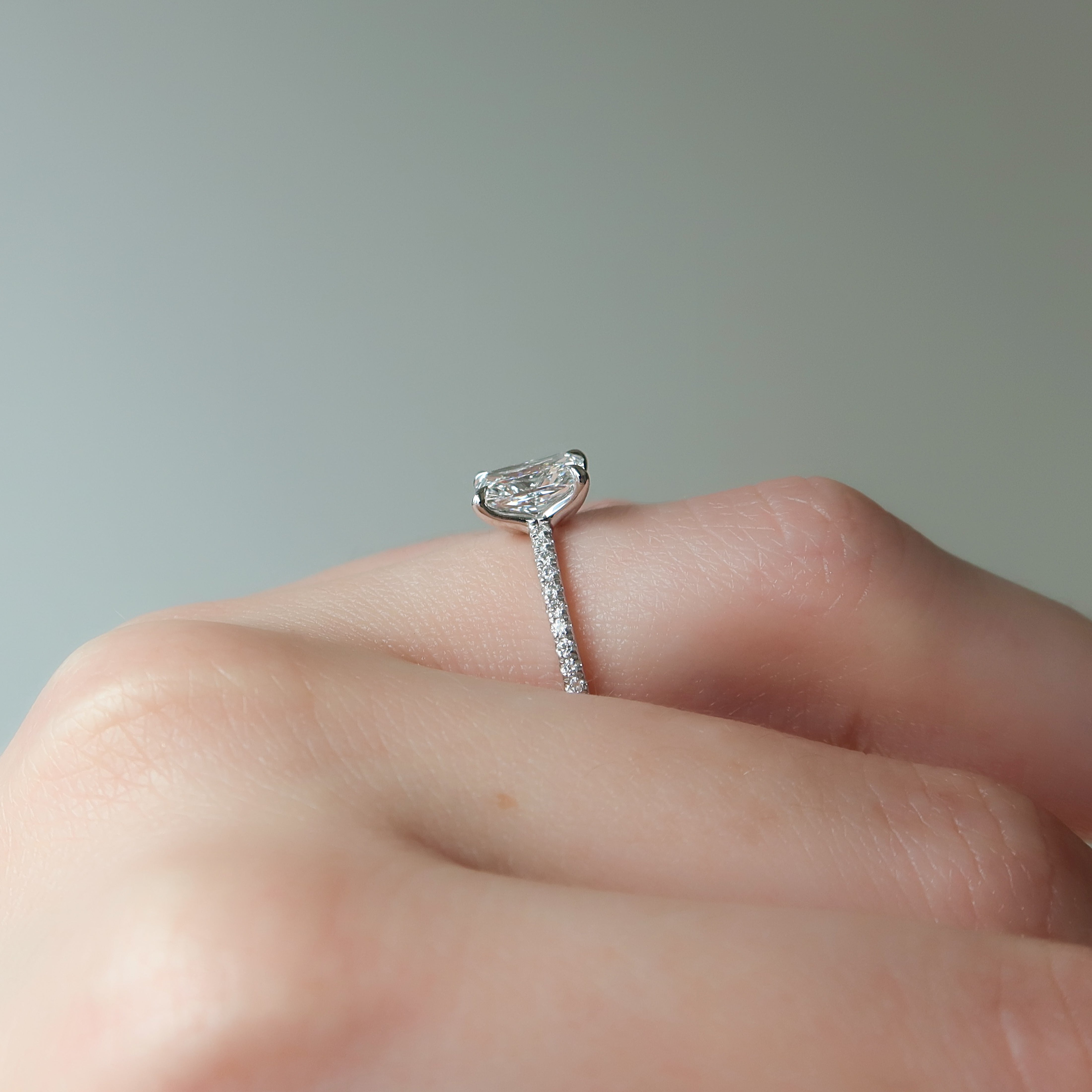 Radiant cut CVD diamond engagement ring with pave diamond band in platinum setting