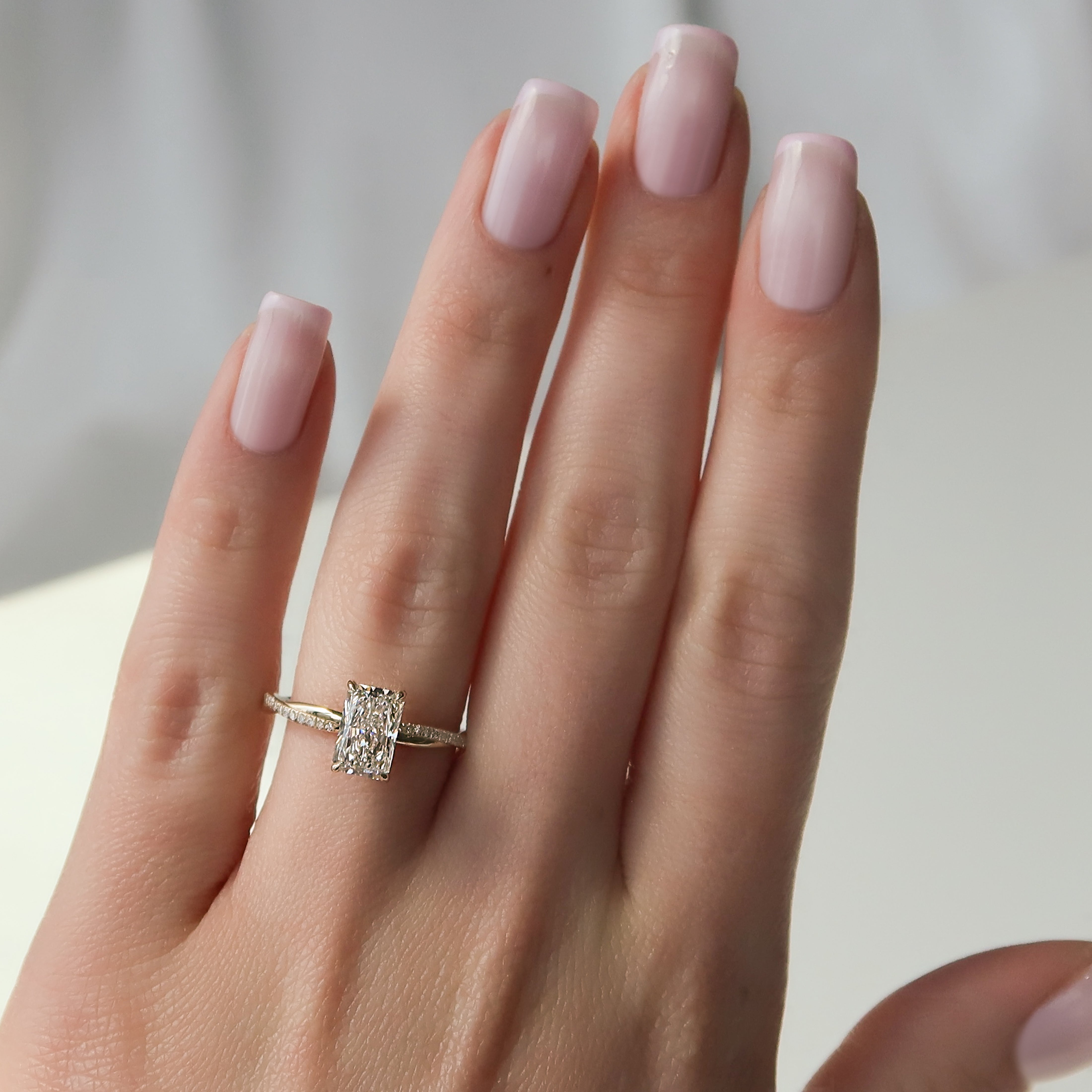 Radiant cut CVD diamond twisted pave engagement ring in white gold setting