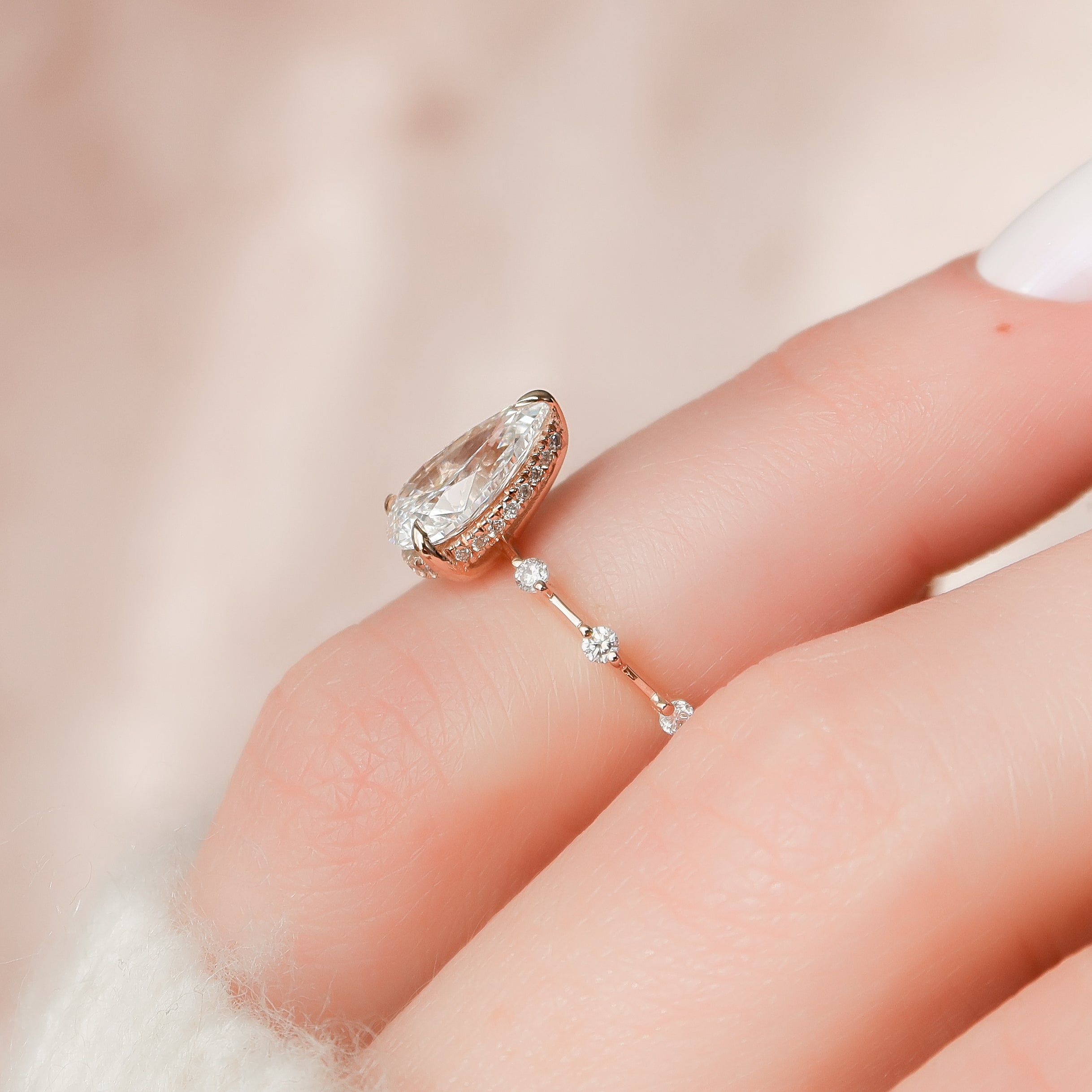Pear cut CVD diamond engagement ring with hidden halo and dainty pave band in white gold