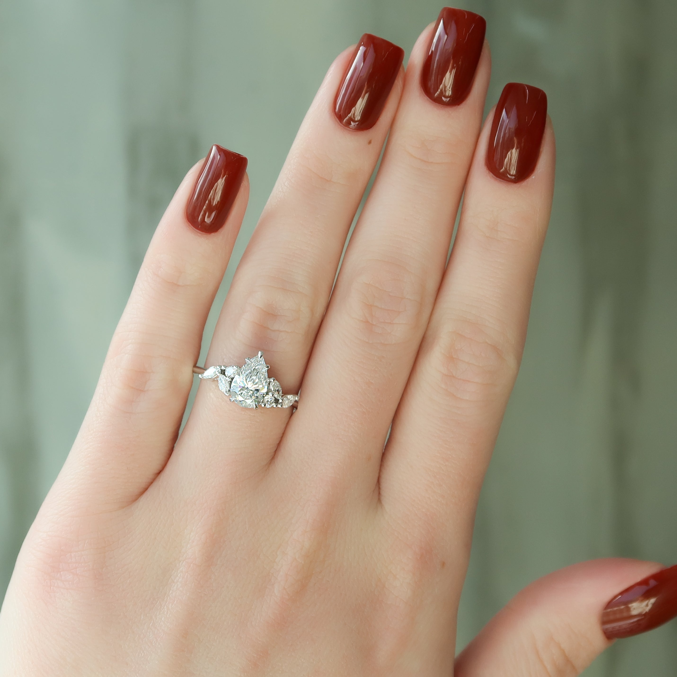 Pear cut CVD diamond cluster engagement ring in platinum setting
