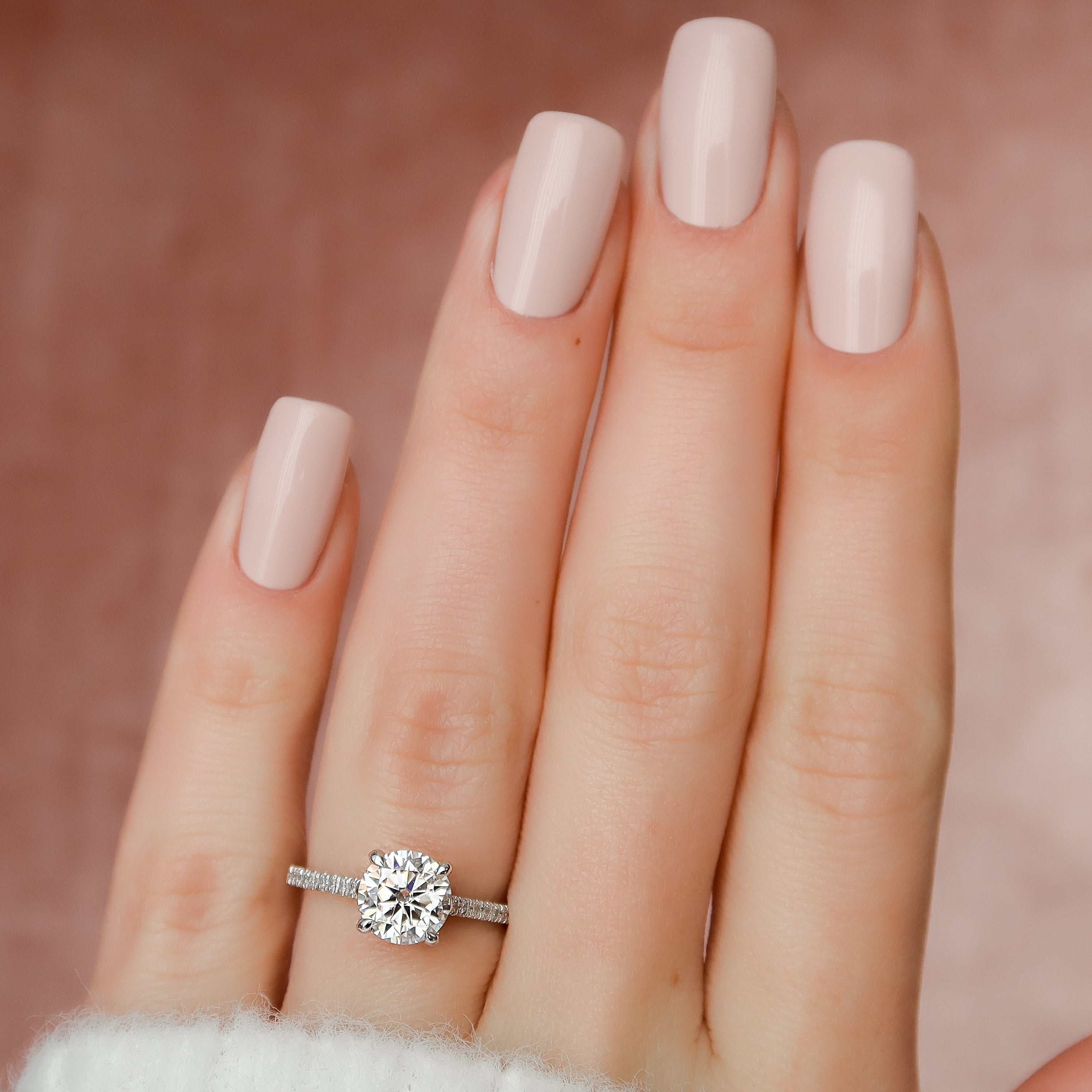 Round cut CVD diamond hidden halo engagement ring with pave diamond band in platinum setting