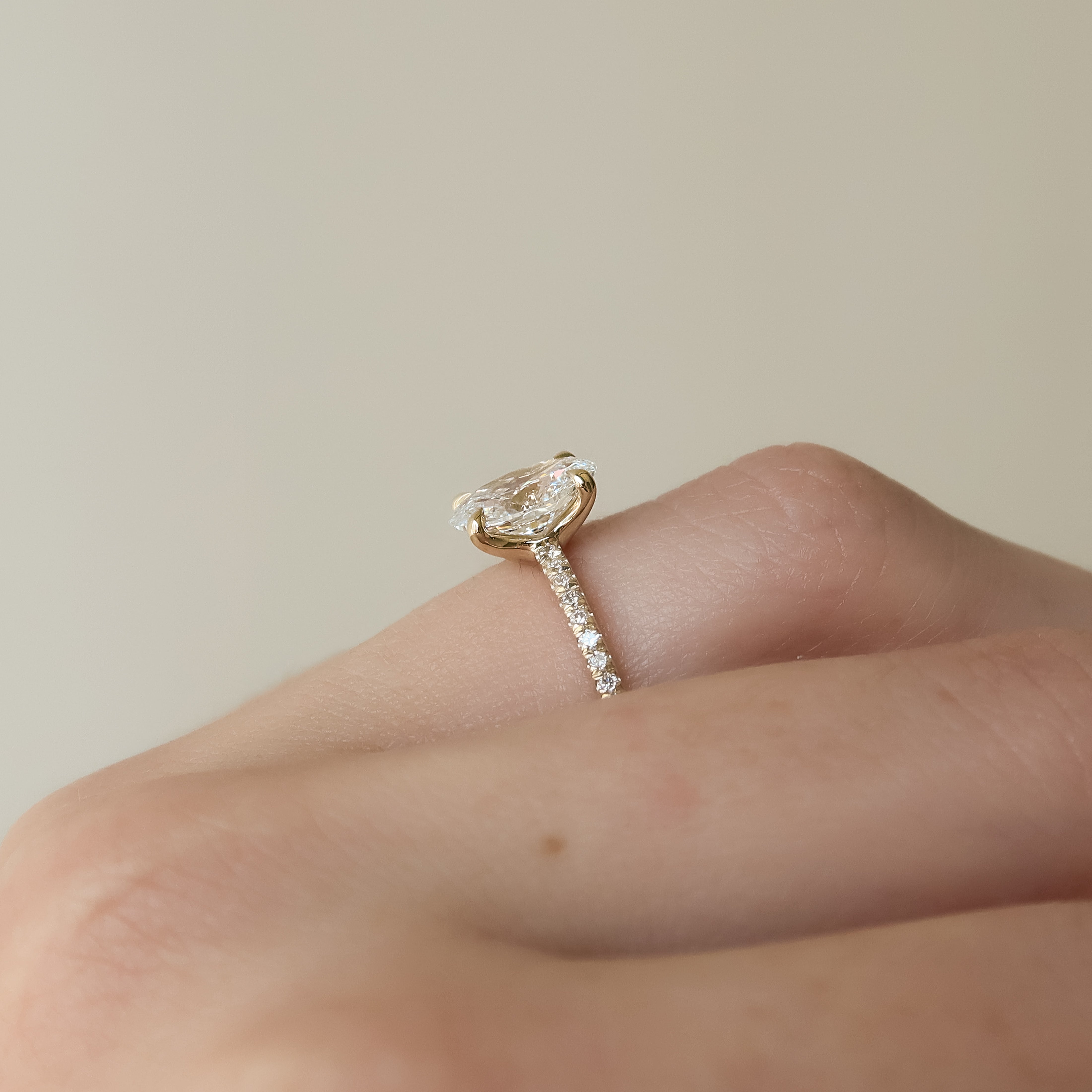 Oval cut CVD diamond pave engagement ring with slim diamond band in white gold