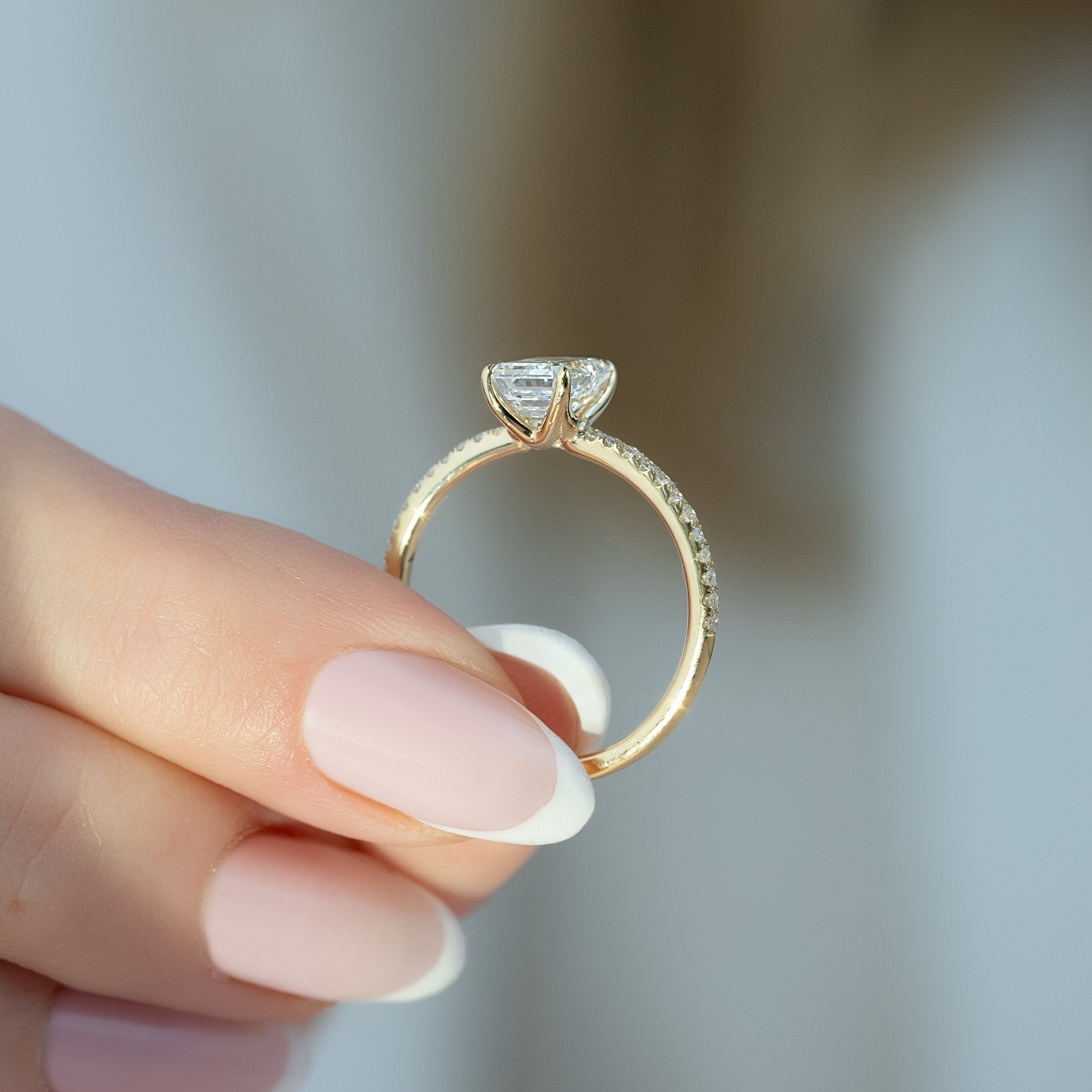Emerald cut CVD diamond pave setting engagement ring in white gold
