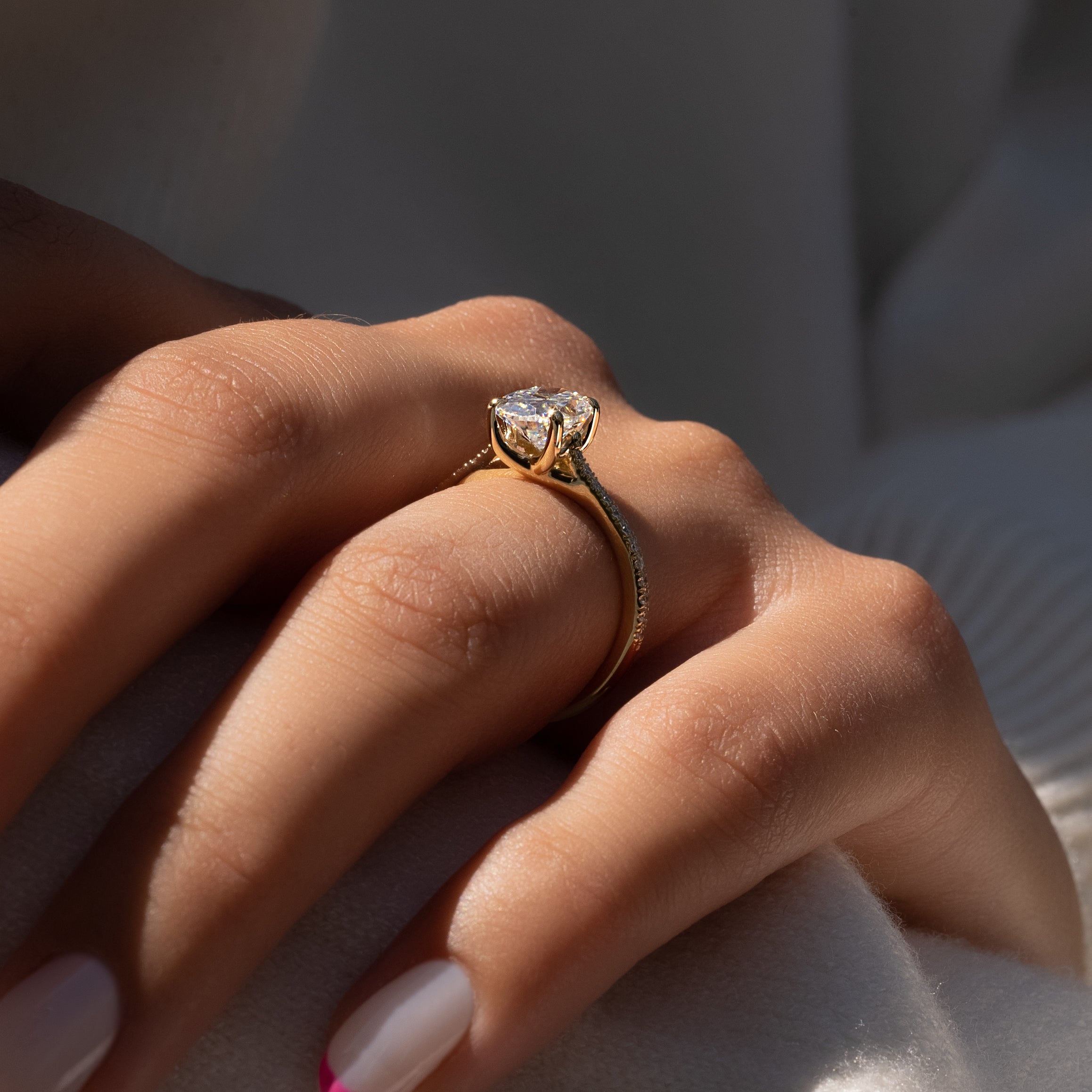 Oval cut CVD diamond engagement ring with pave diamond band in platinum setting