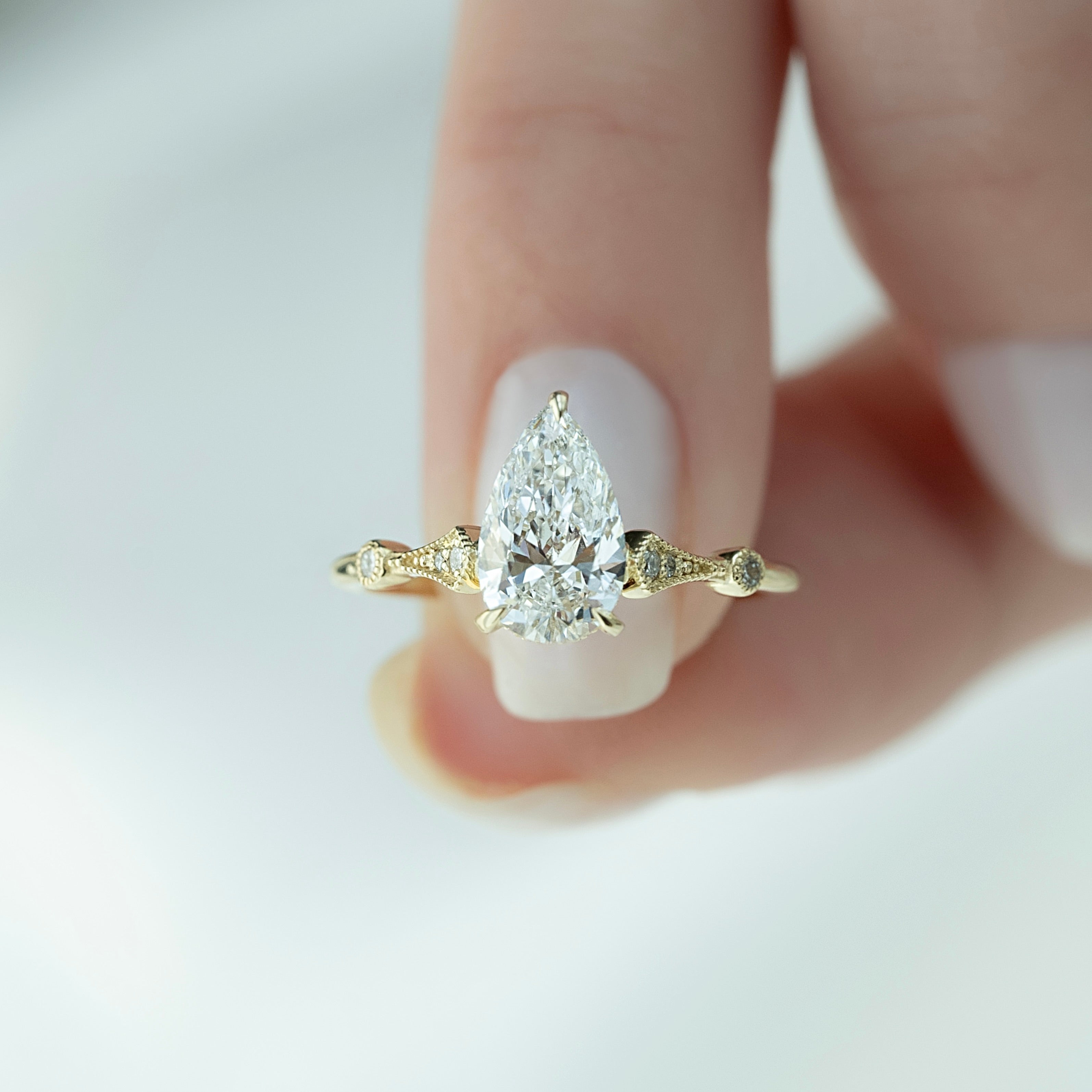 Pear cut CVD diamond vintage style engagement ring with intricate detailing
