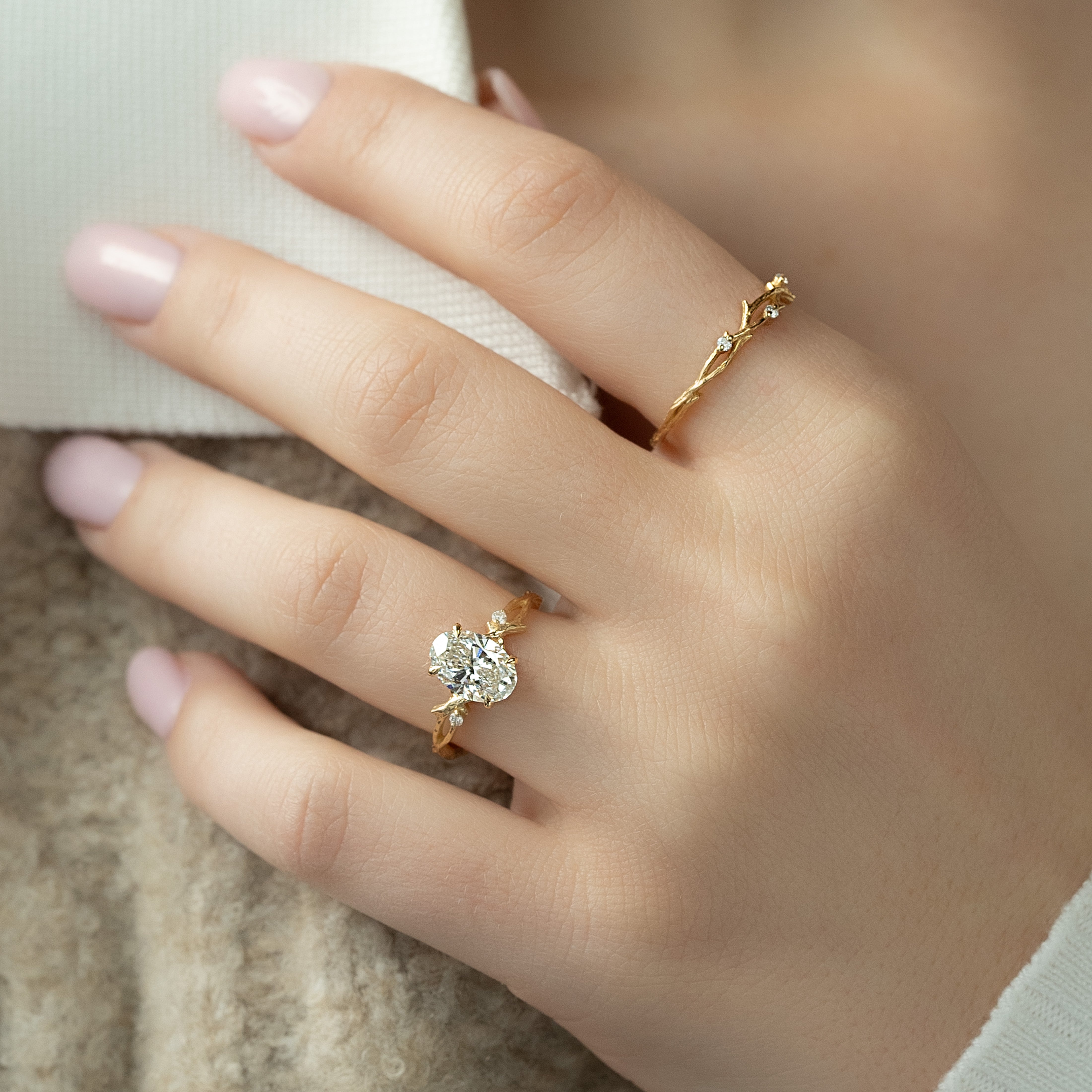 Oval cut CVD diamond engagement ring with twig-style band in white gold