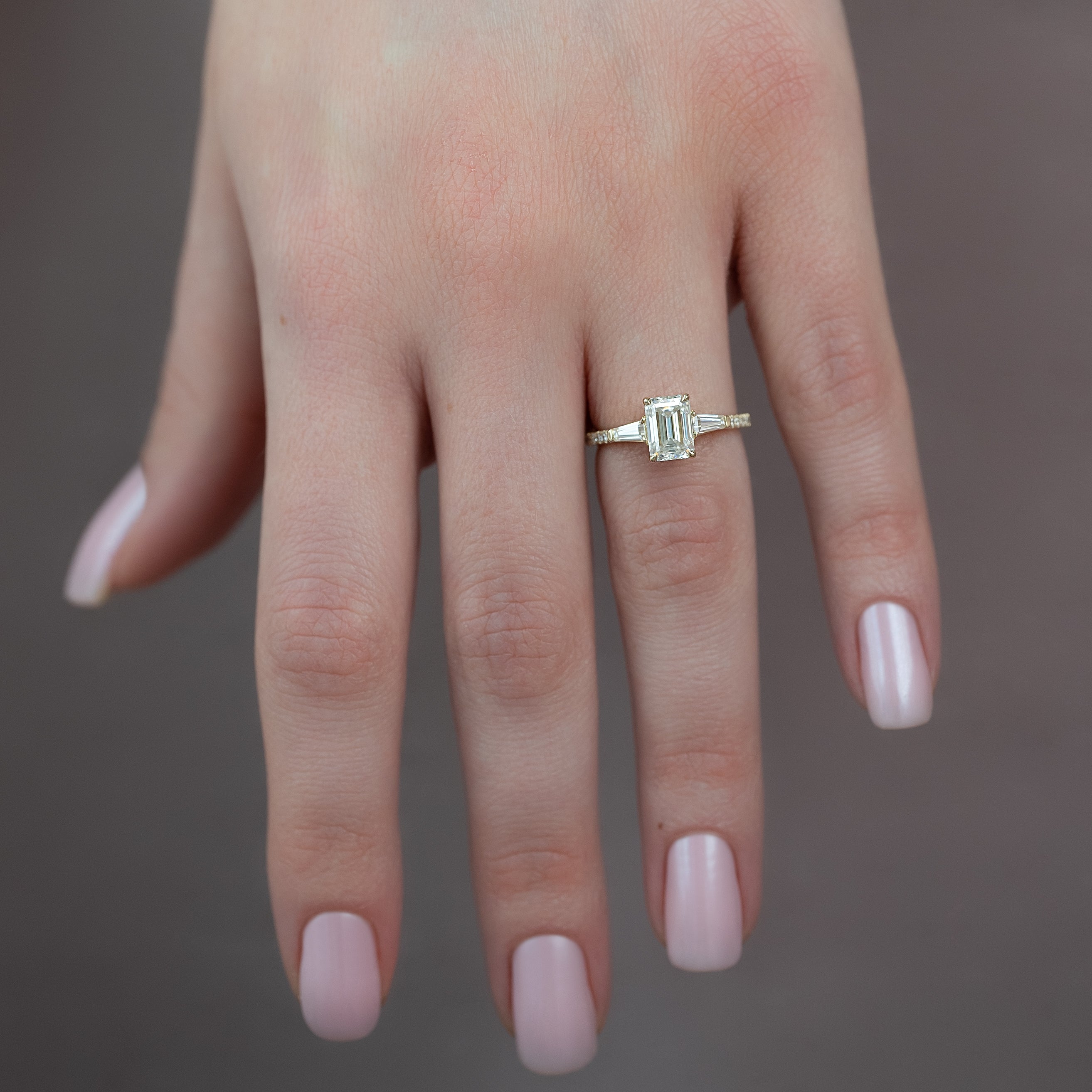 Emerald cut CVD diamond engagement ring with pave band in white gold