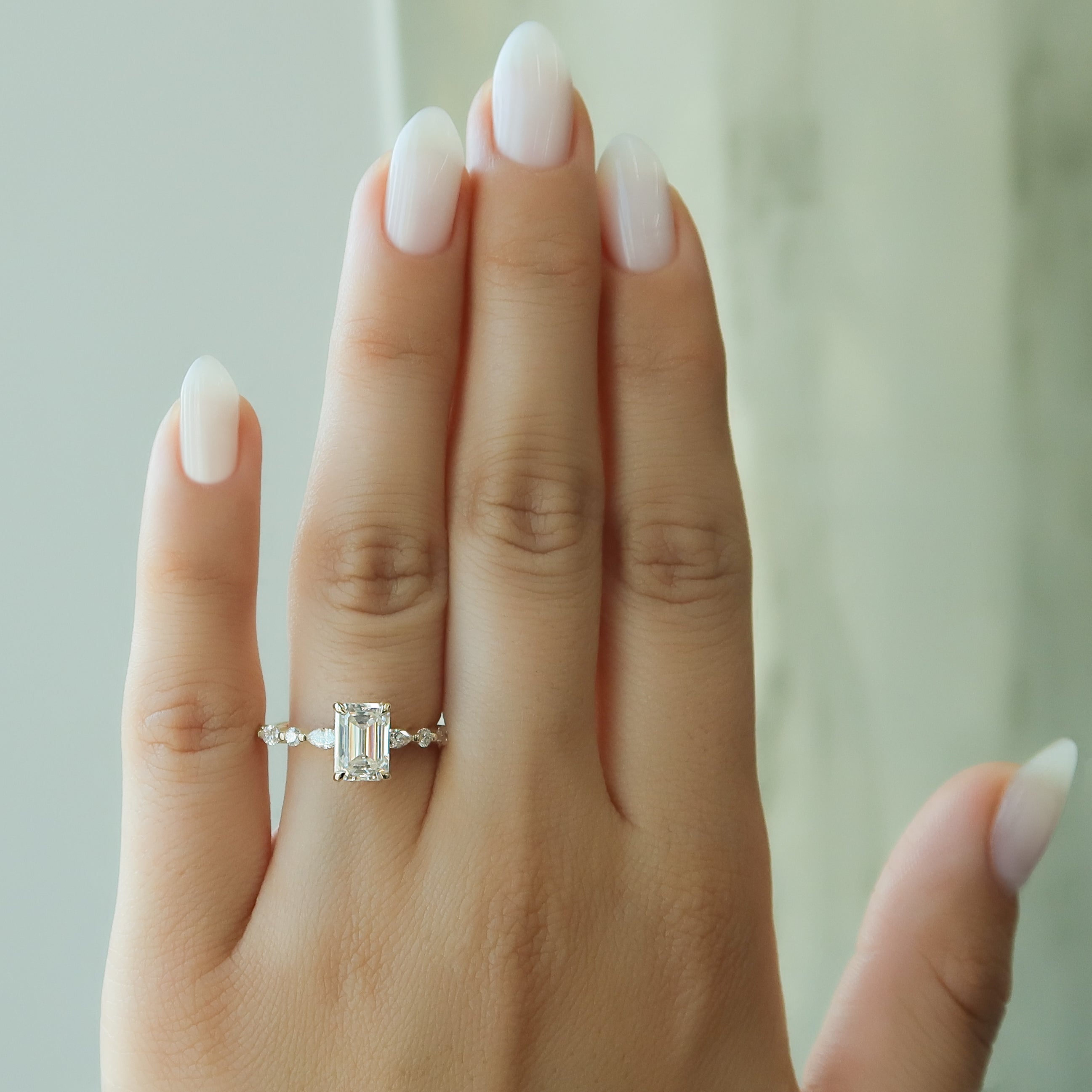 Emerald cut CVD diamond hidden halo engagement ring in white gold setting