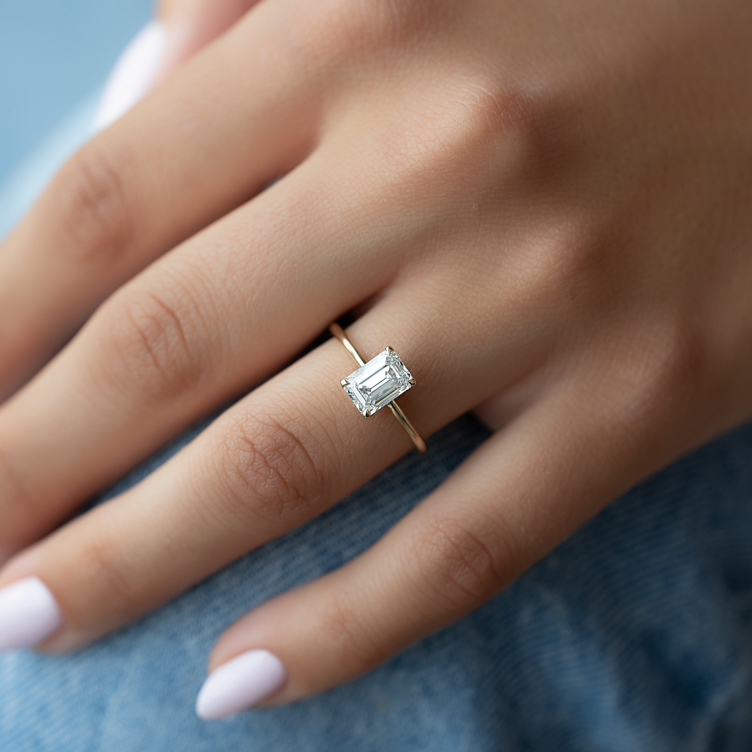Emerald cut CVD diamond solitaire engagement ring in platinum setting