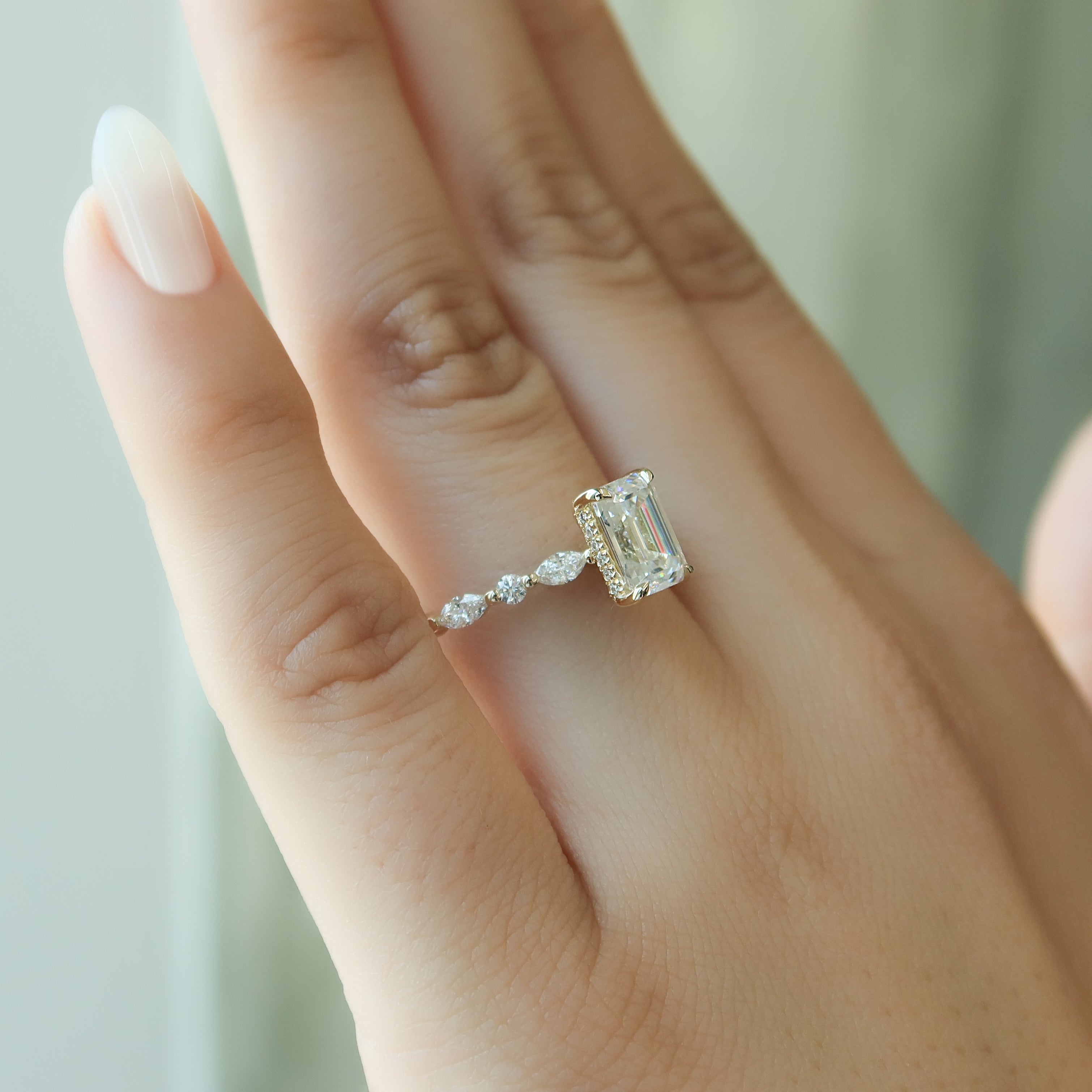 Emerald cut CVD diamond hidden halo engagement ring in white gold setting