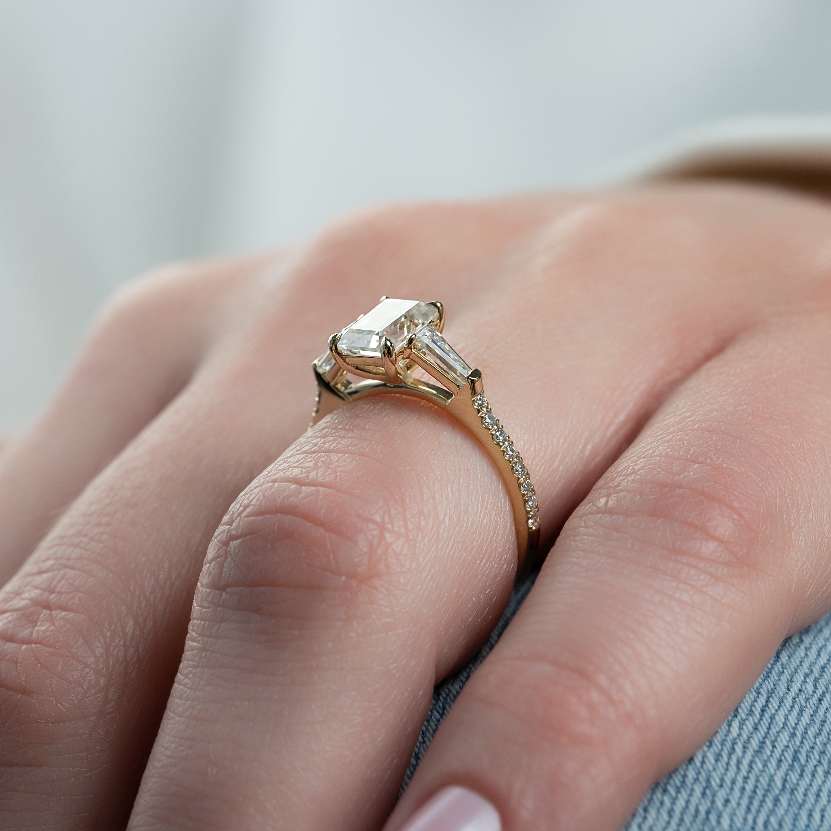 Emerald cut CVD diamond engagement ring with pave band in white gold