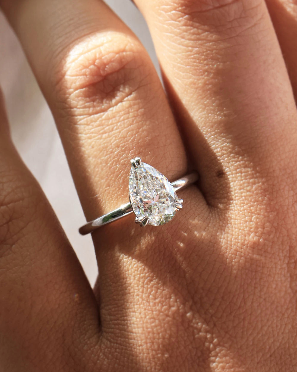 2.0–4.0 CT pear cut lab grown CVD diamond solitaire engagement ring in a classic setting for a sleek and modern bridal look