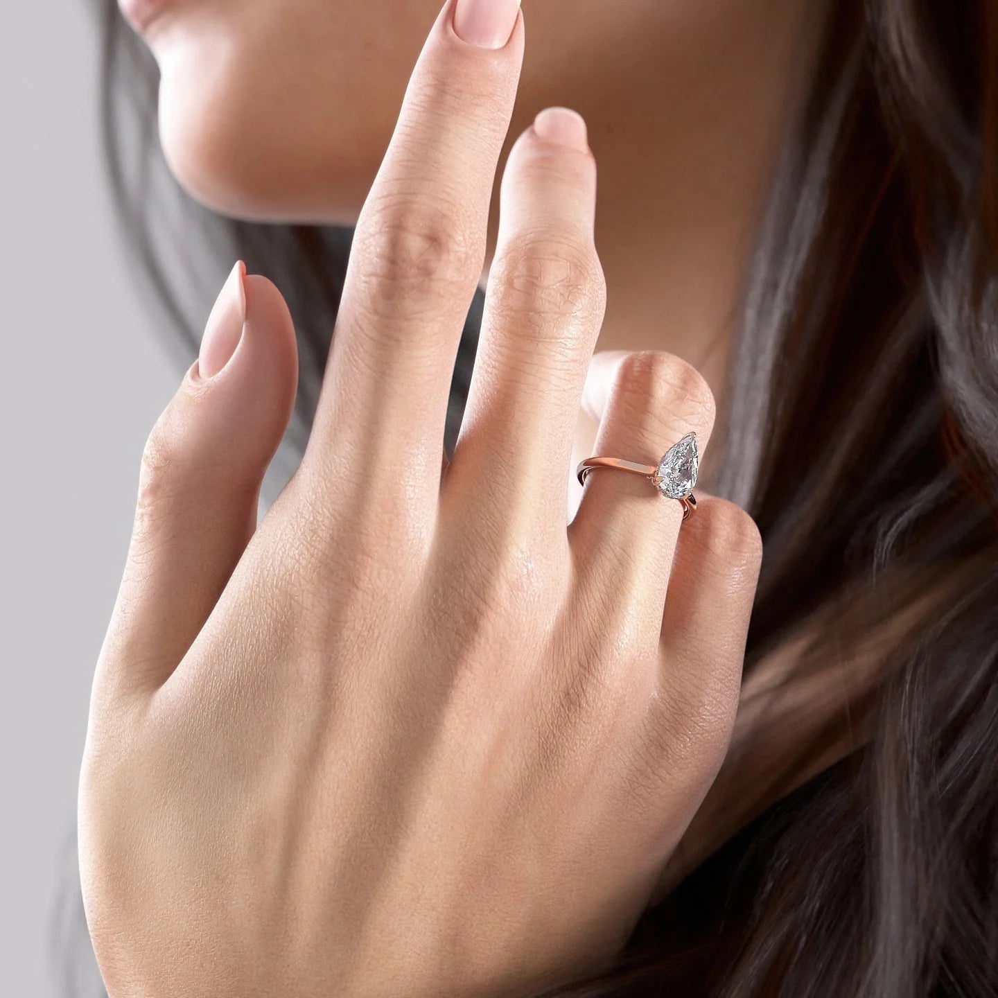 Pear cut CVD diamond engagement ring with hidden halo in white gold setting
