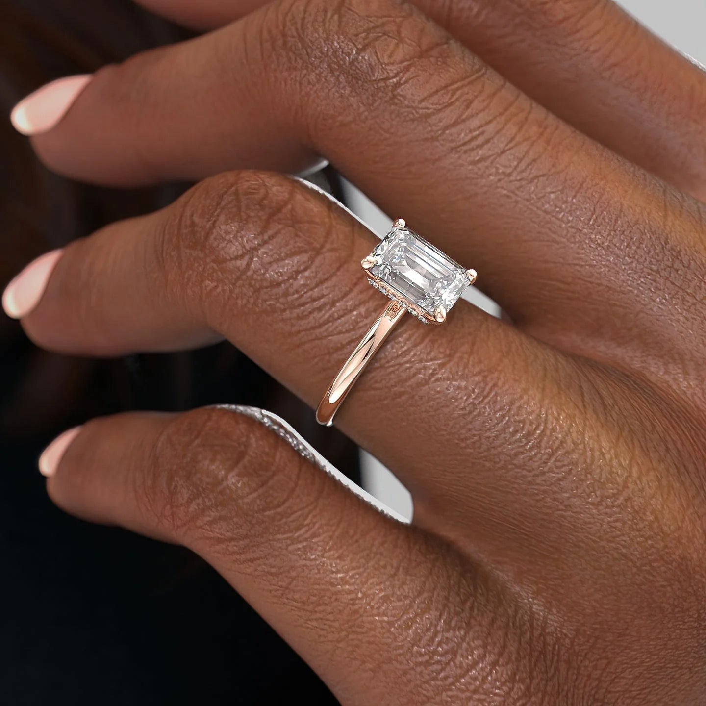 Emerald cut CVD diamond hidden halo engagement ring in white gold setting