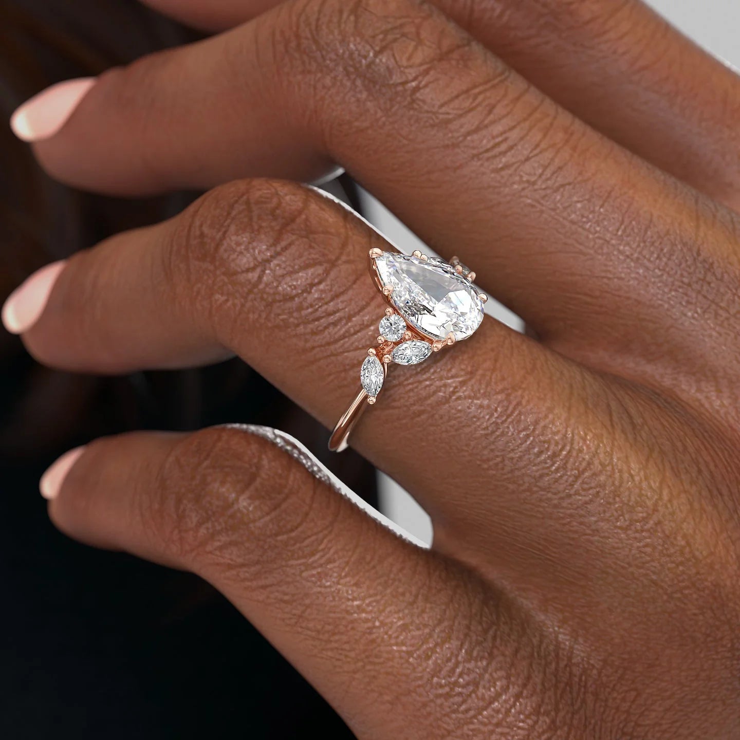 Pear cut CVD diamond cluster engagement ring in platinum setting