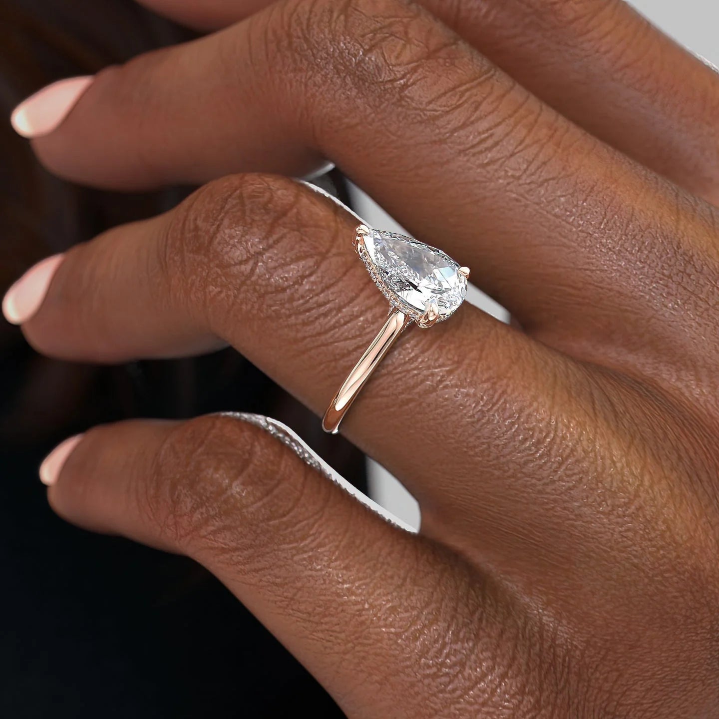 Pear cut CVD diamond engagement ring with hidden halo in white gold setting
