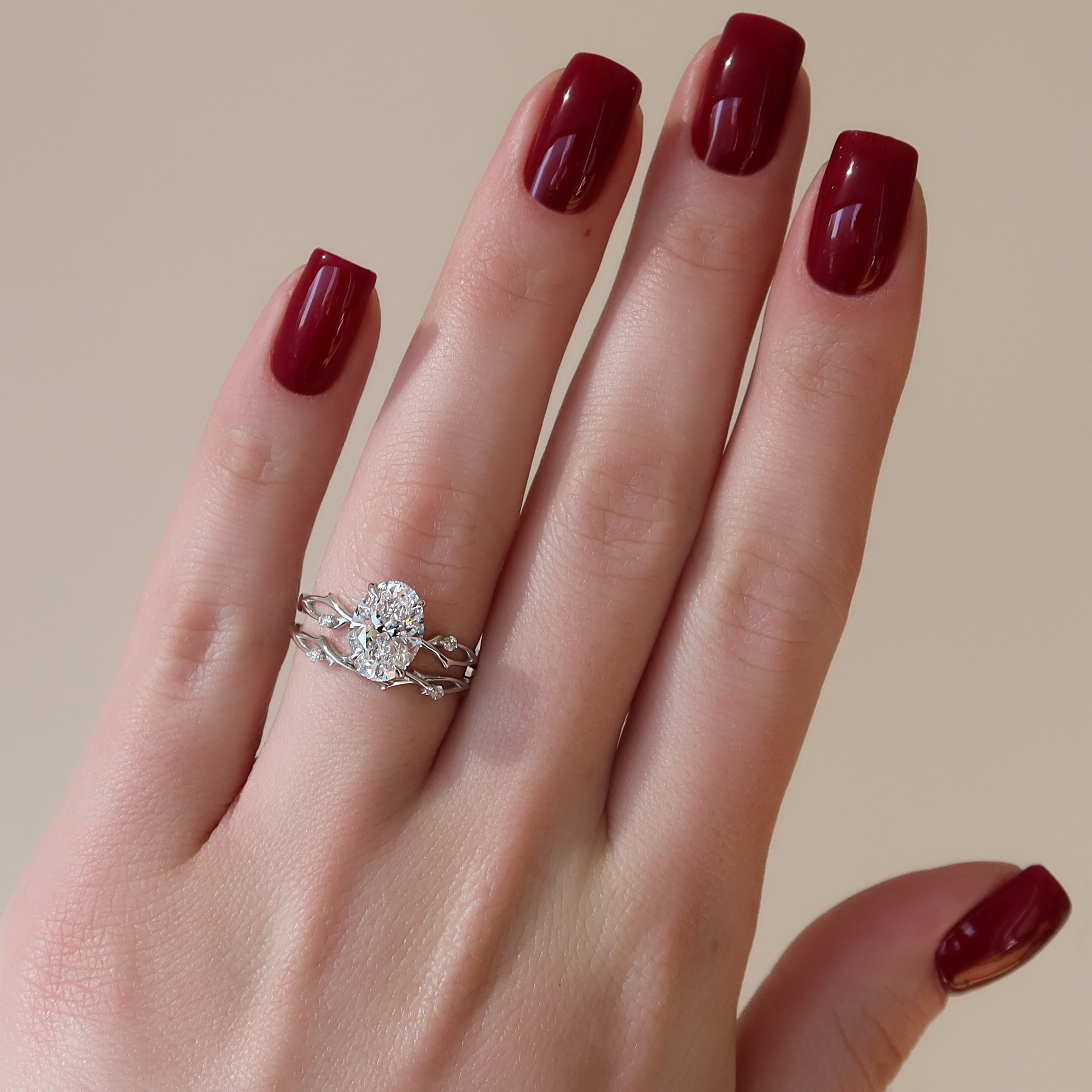 Oval cut CVD diamond engagement ring with twig-style band in white gold