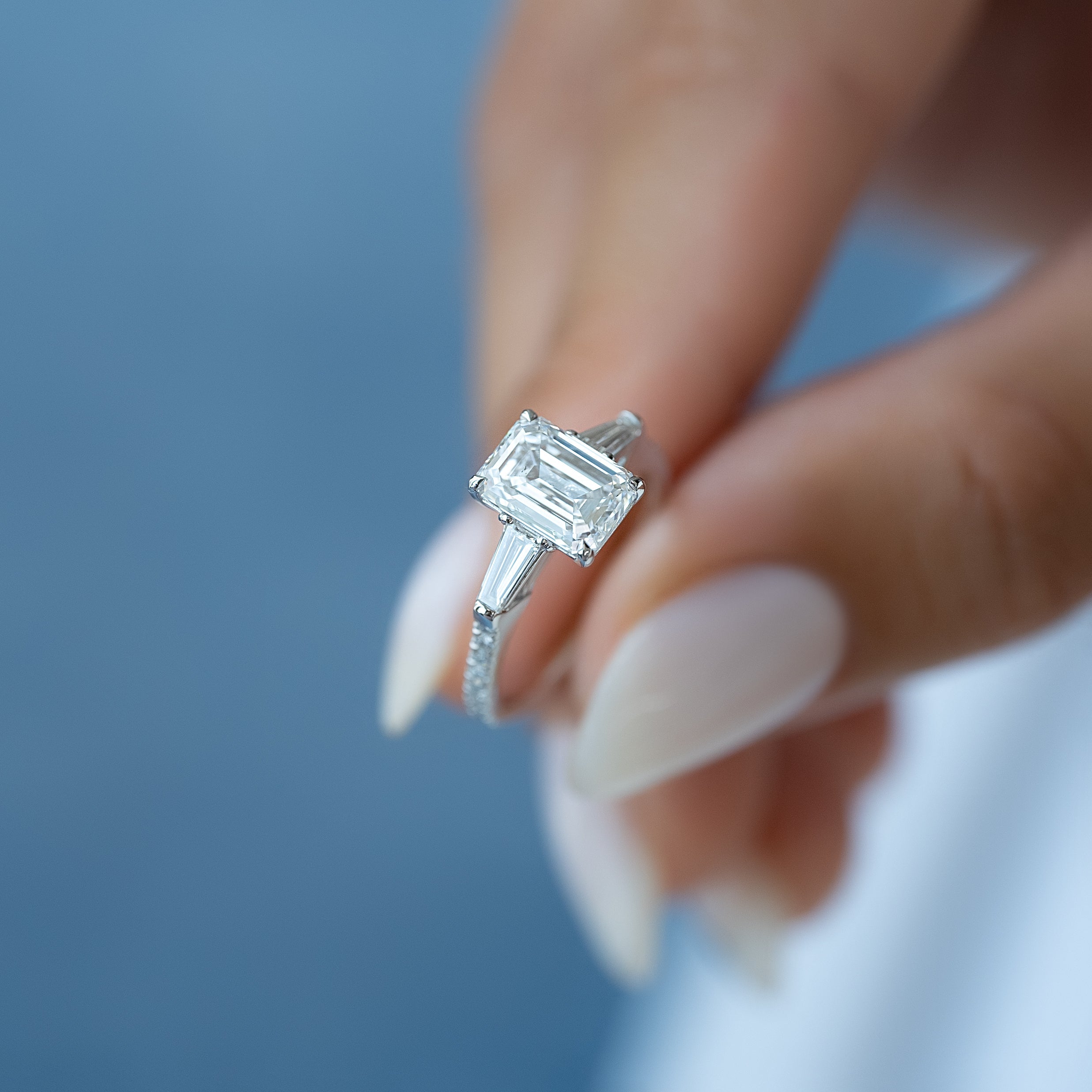 Emerald cut CVD diamond engagement ring with pave band in white gold