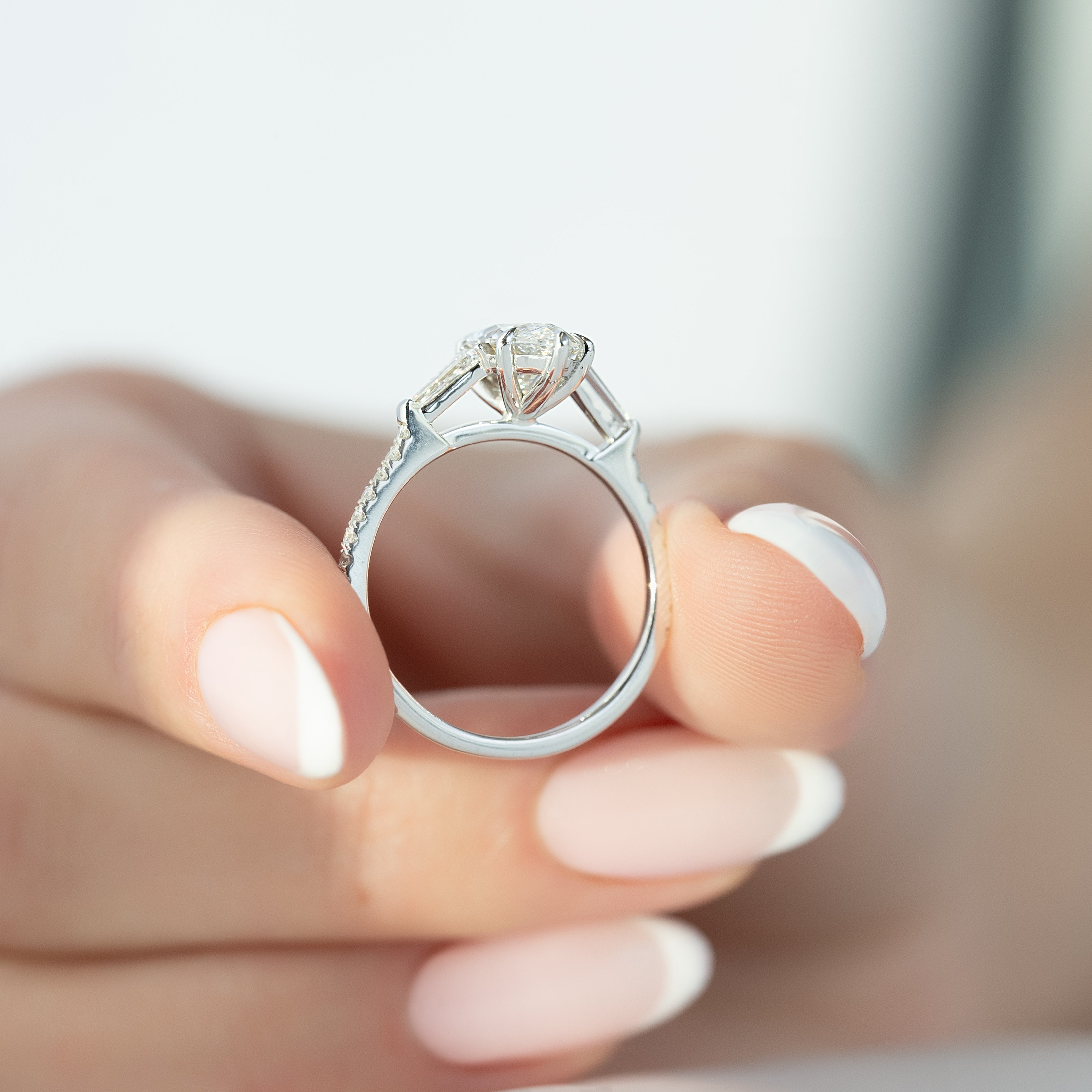 Marquise cut CVD diamond three stone engagement ring with pave band in white gold