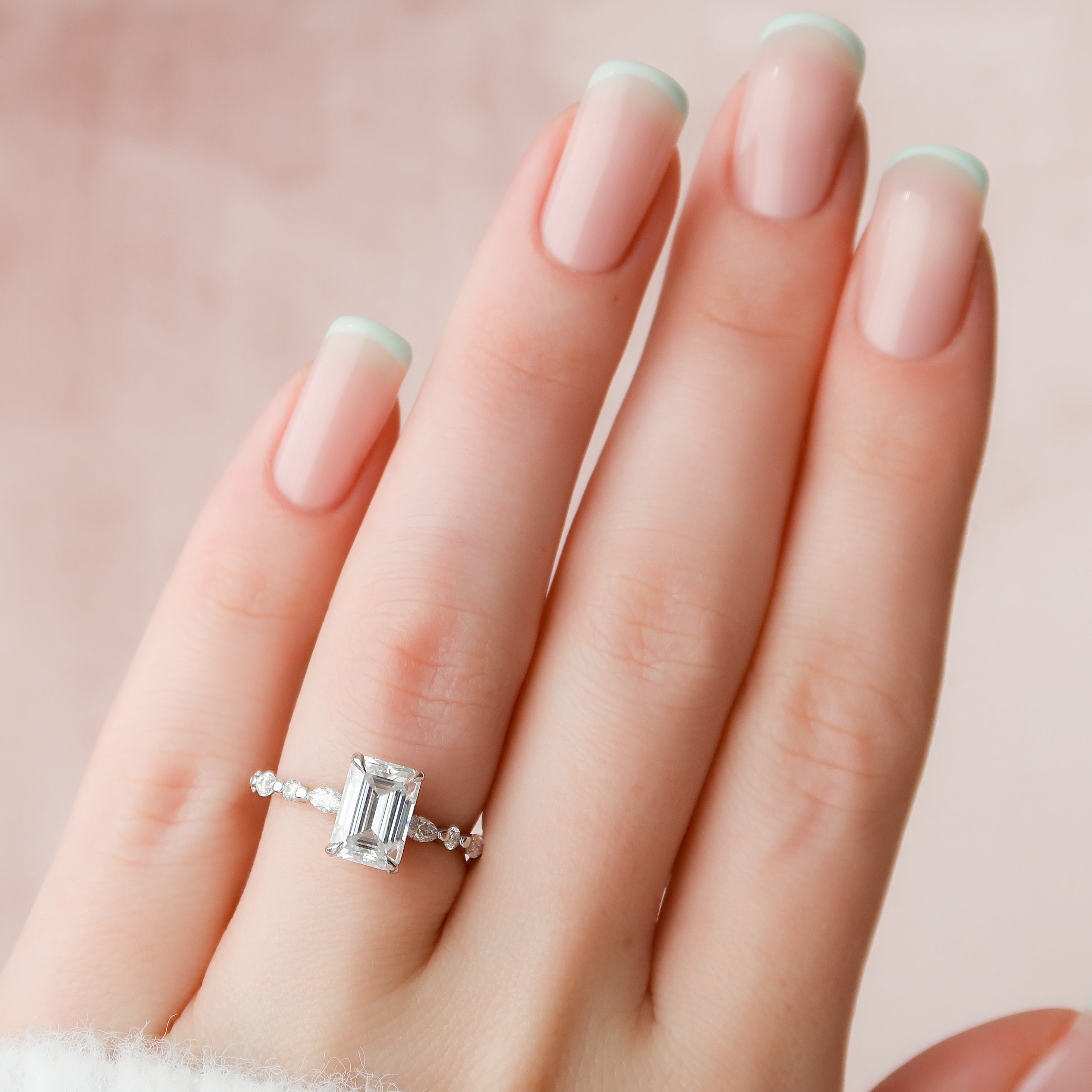 Emerald cut CVD diamond hidden halo engagement ring in white gold setting
