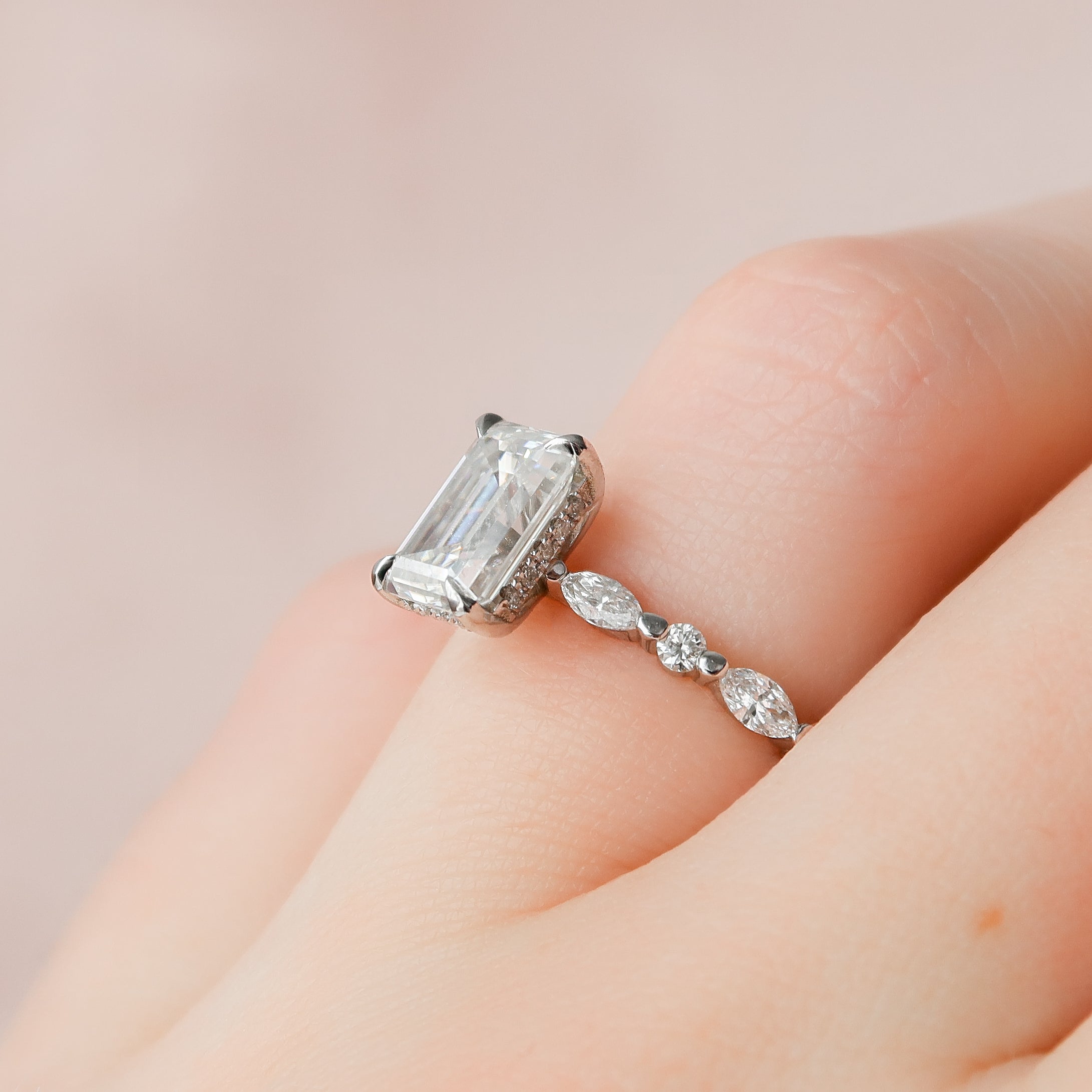 Emerald cut CVD diamond hidden halo engagement ring in white gold setting