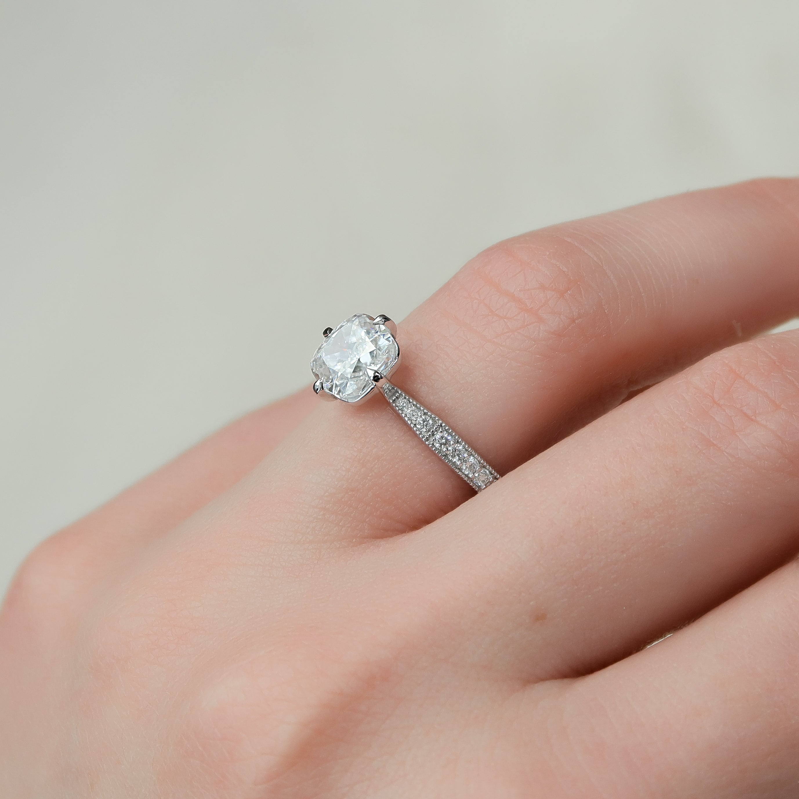 Cushion cut CVD diamond pave engagement ring with diamond-accented band in white gold